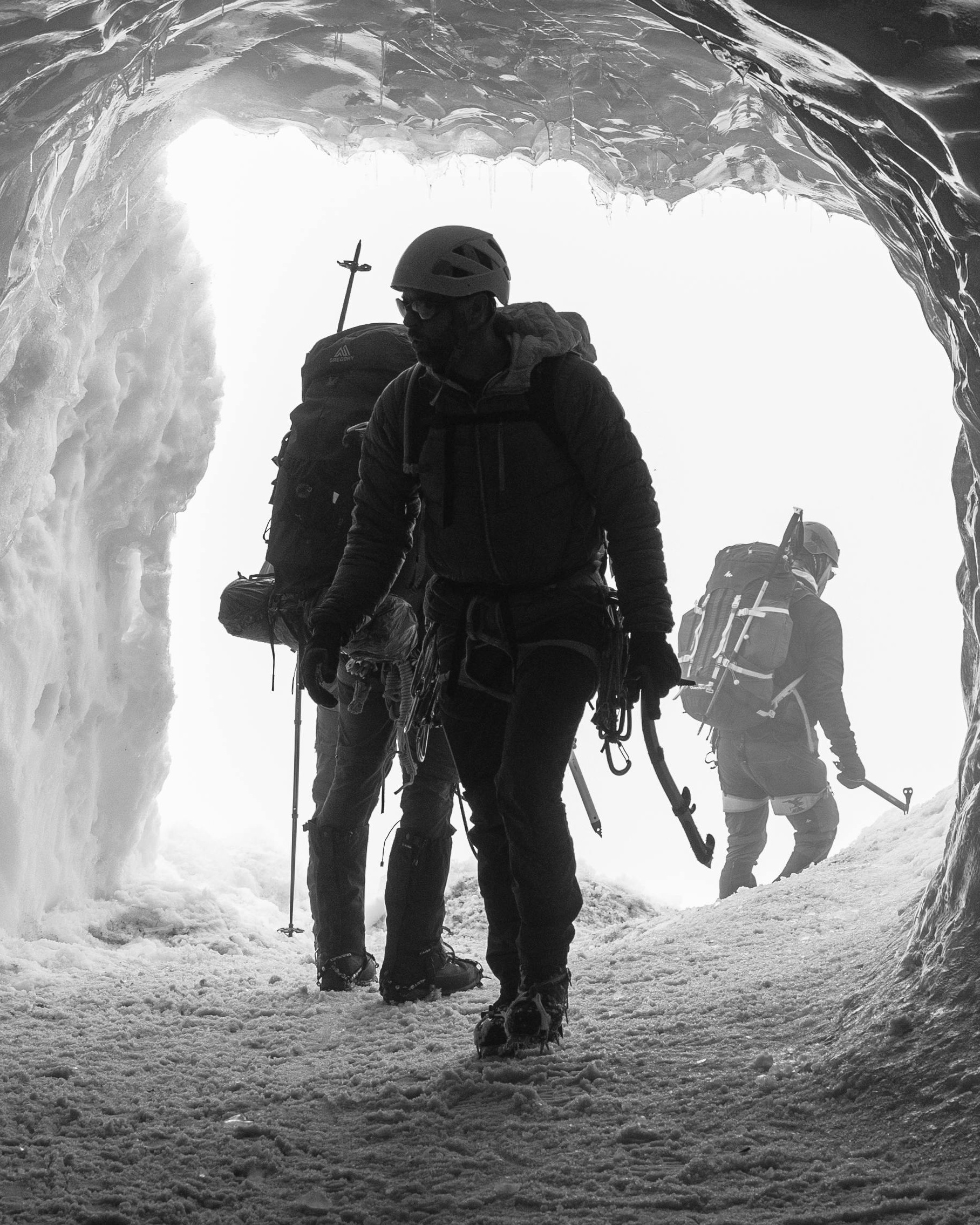 Mountaineers Exiting Ice Cave