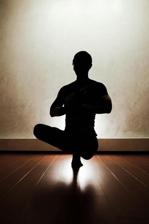 Silhouette of Person Practicing Yoga