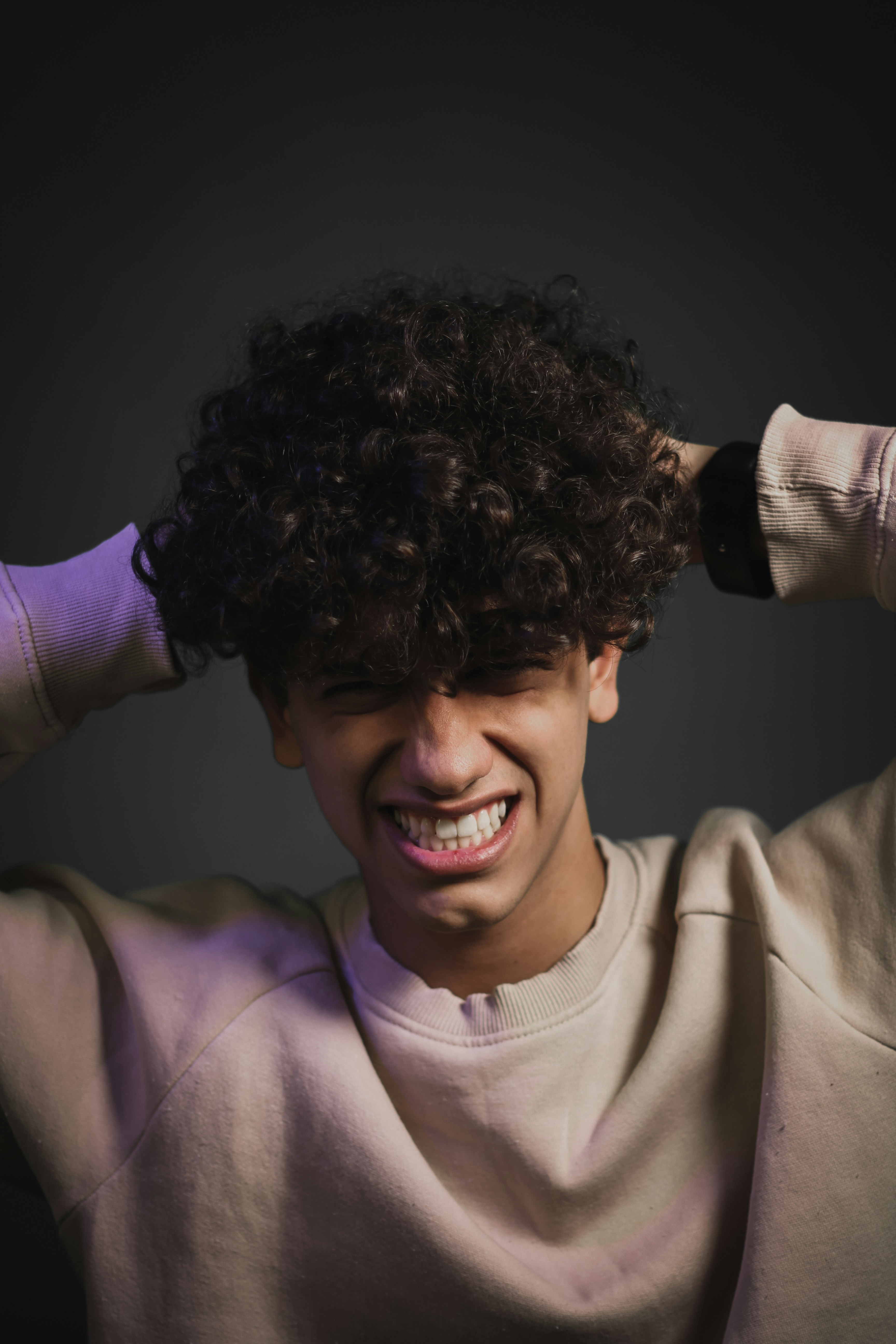 Young Man With Hands On Head