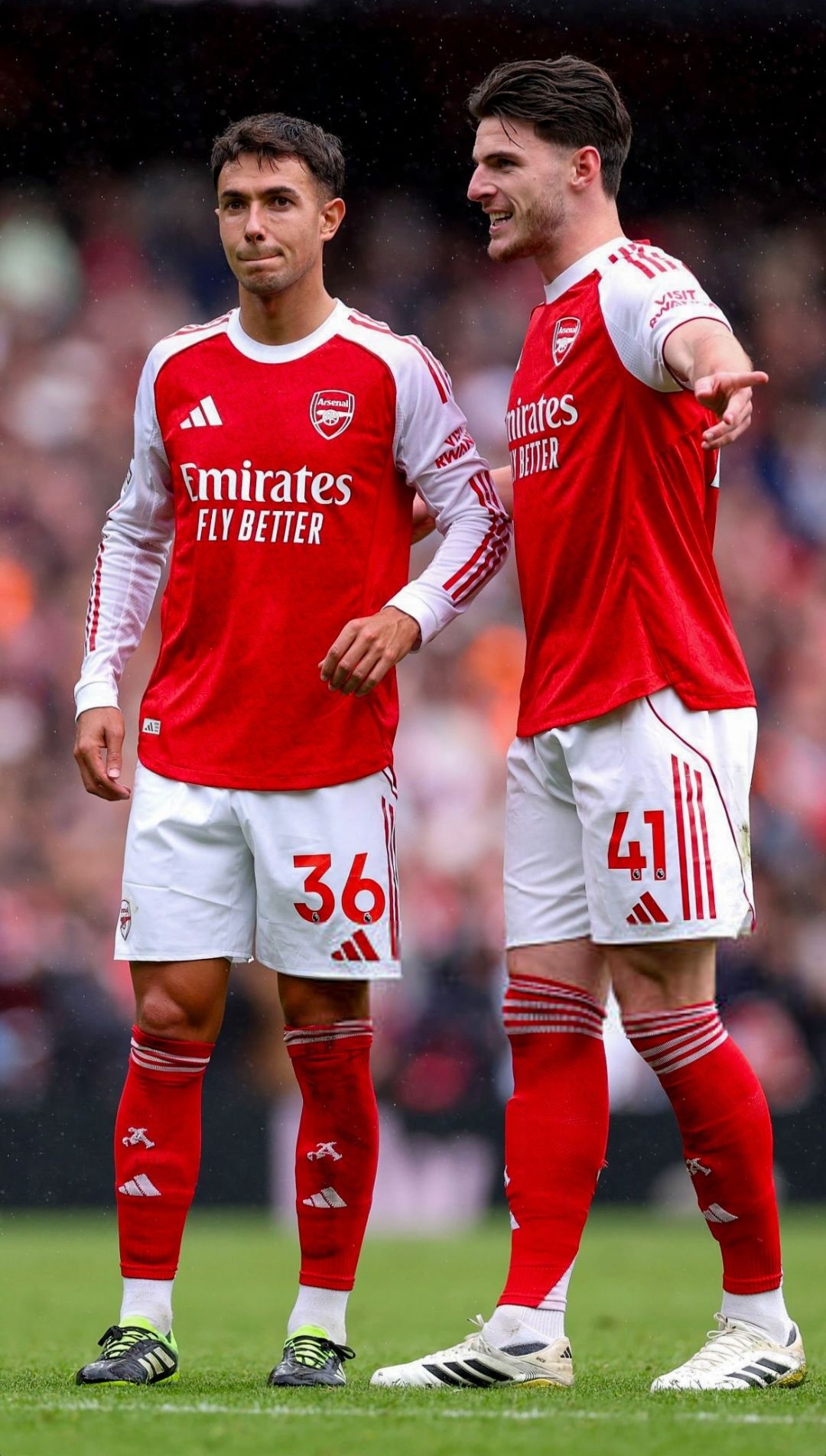 Two Arsenal Players on Football Pitch