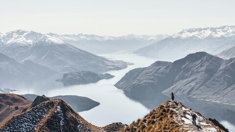 Hikers Overlooking Alpine Lake