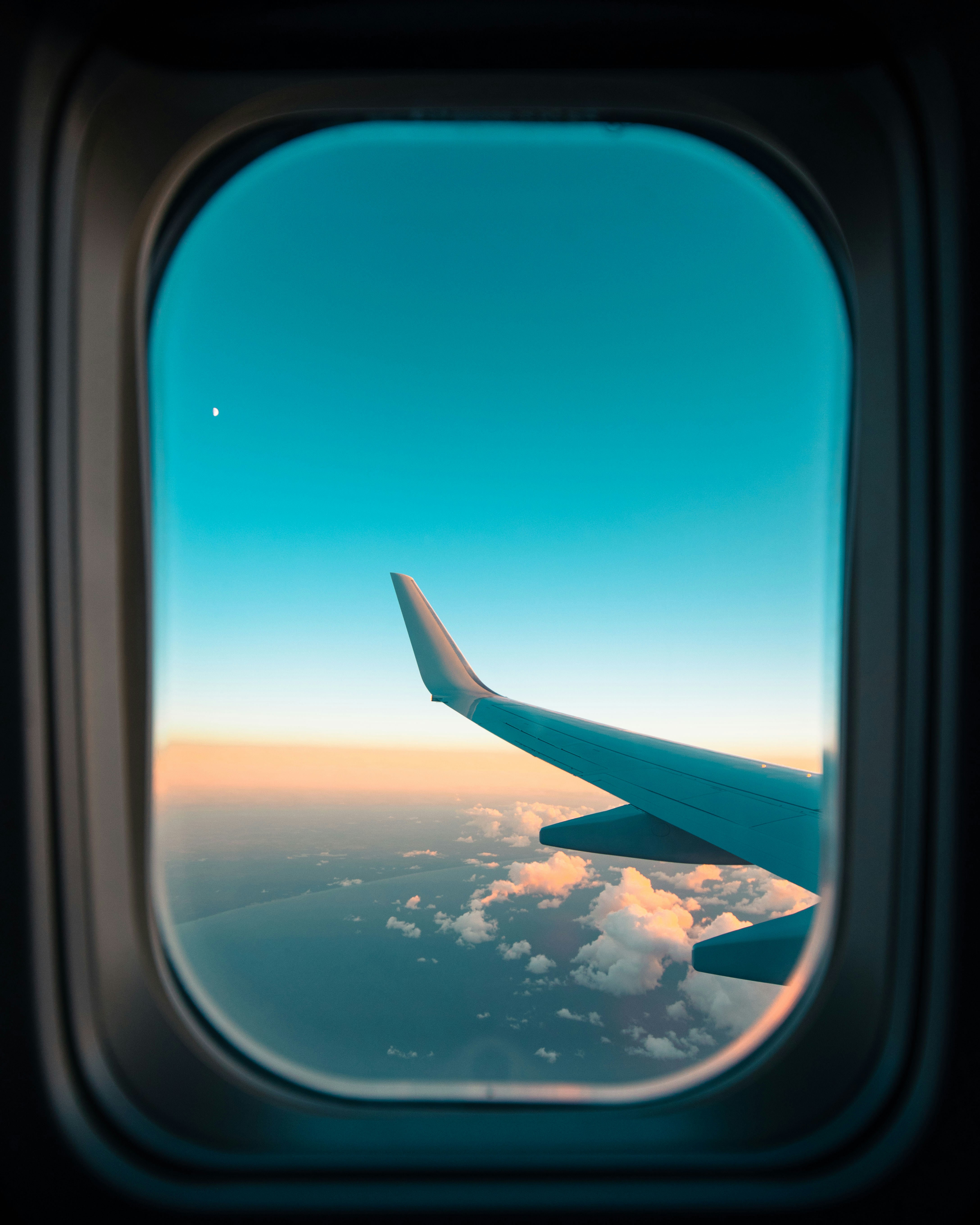 Airplane Window View of Wing and Sky