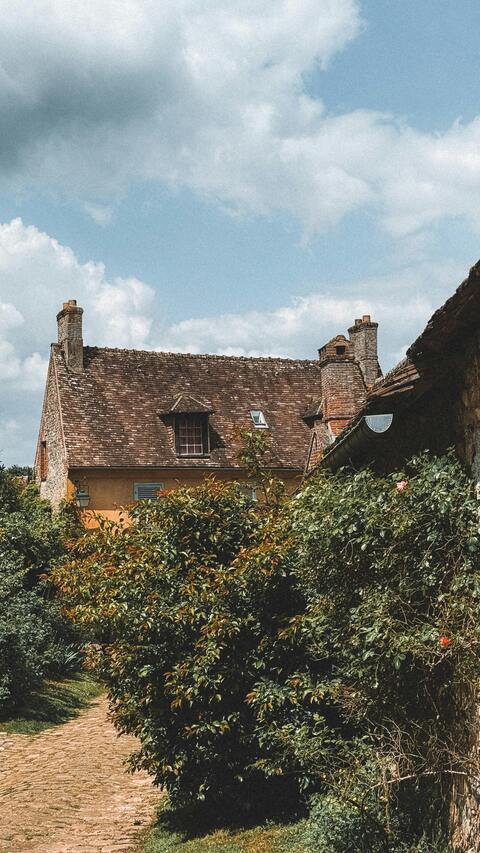Old Country Cottage on Cobblestone Path