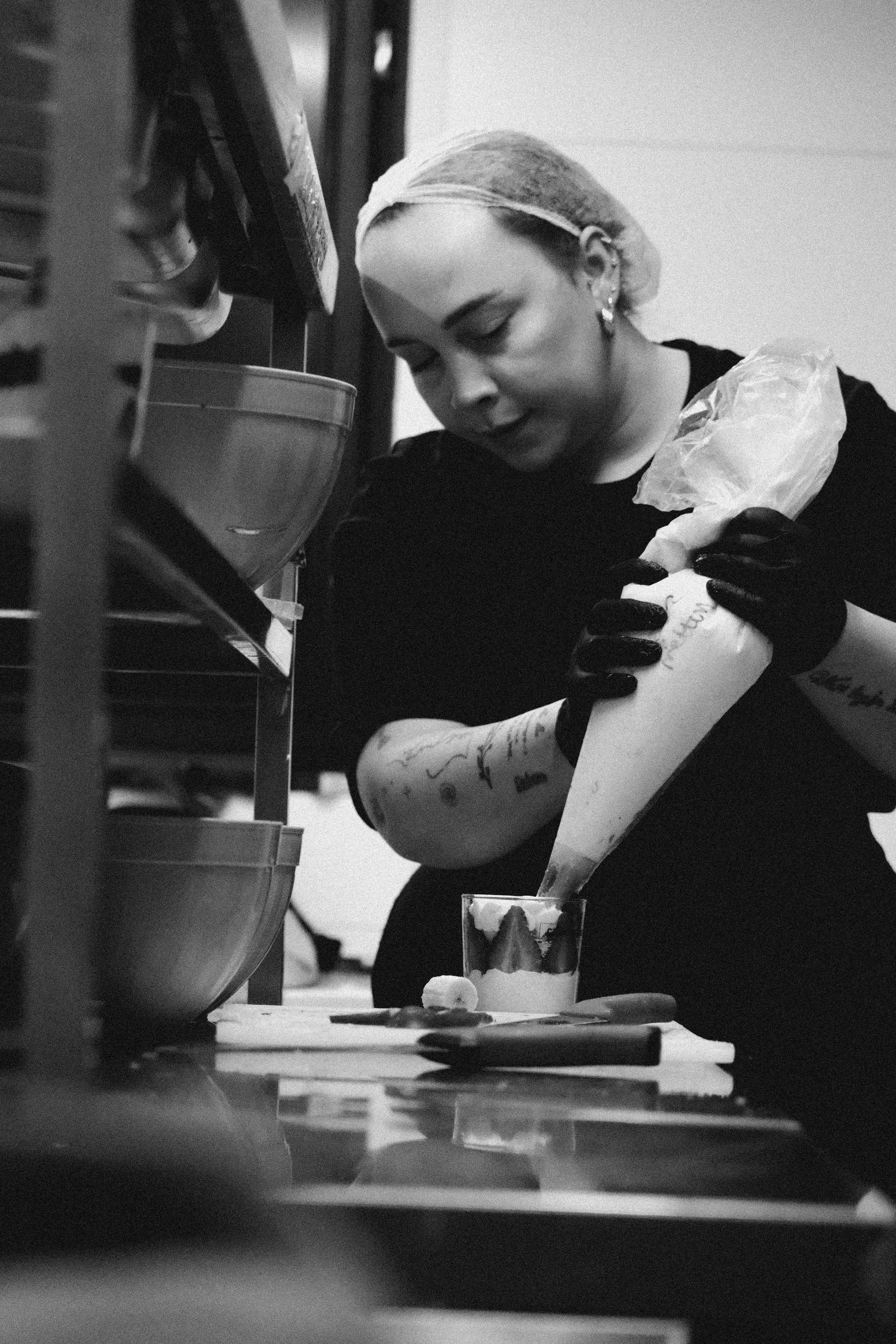 Pastry Chef Assembling Layered Dessert