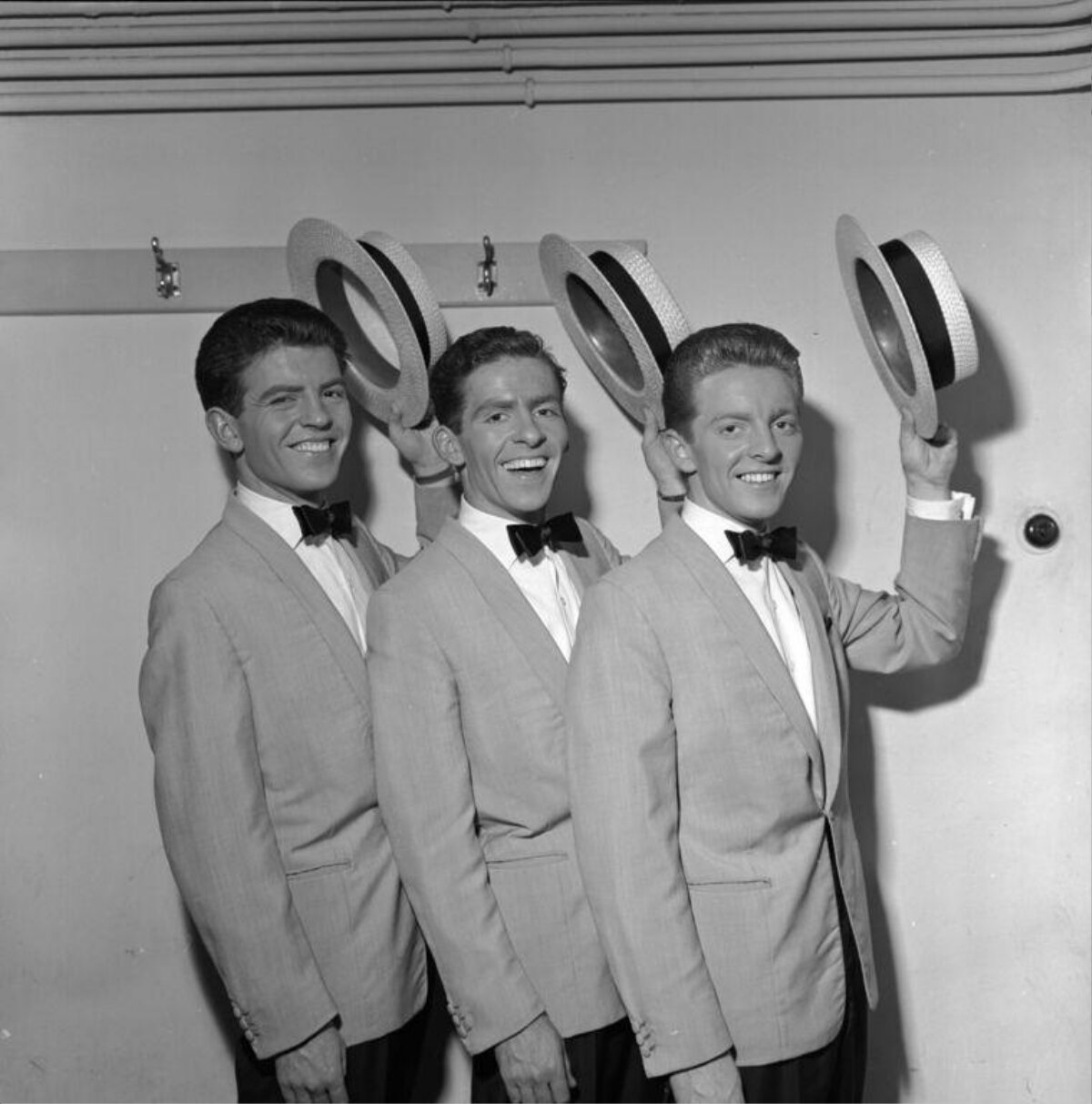 Three Performers Tipping Hats