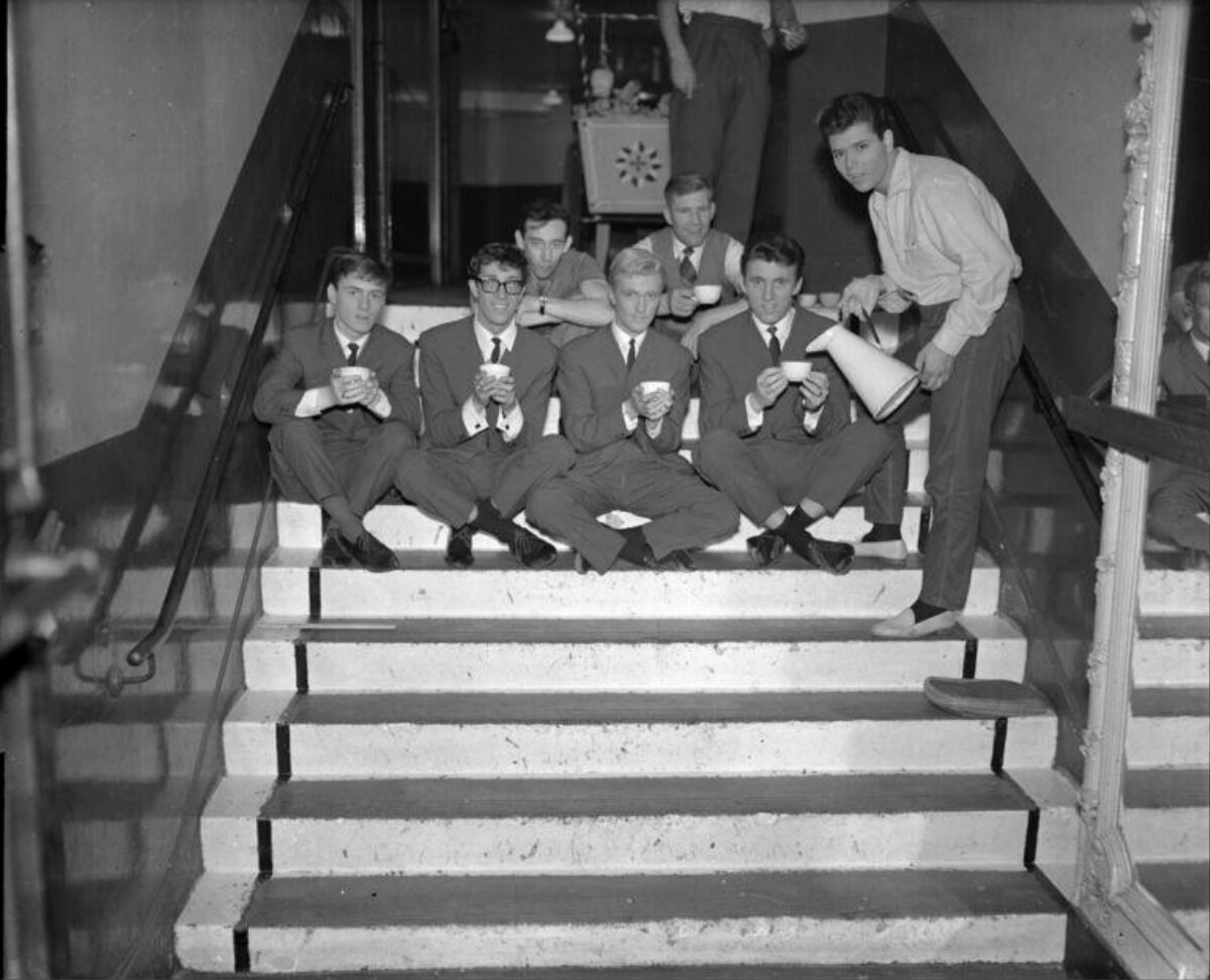 1960s Musicians Having Tea on Stairs