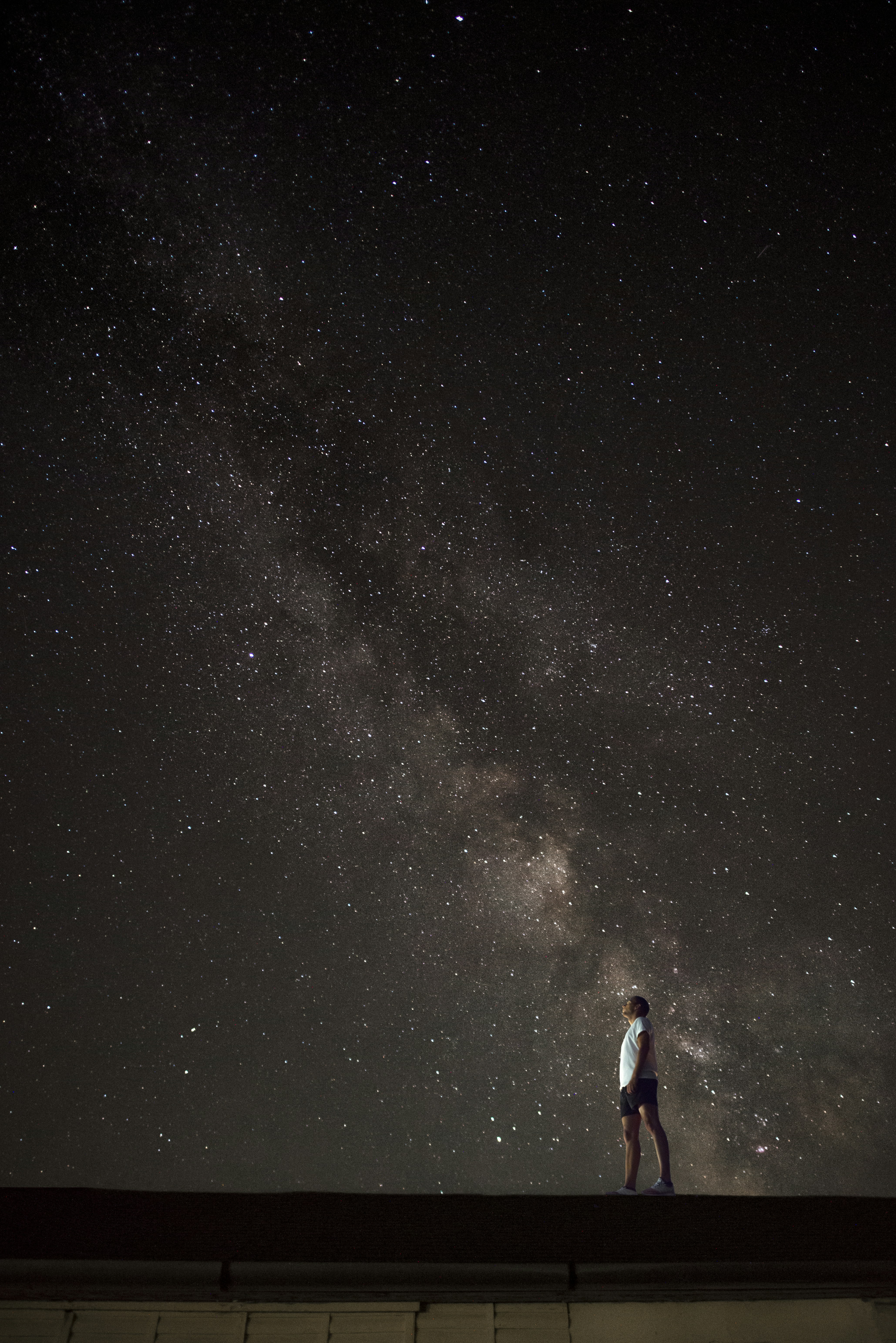Man Gazing At Starry Night Sky