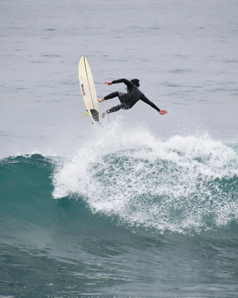Surfer Wipeout Above Breaking Ocean Wave