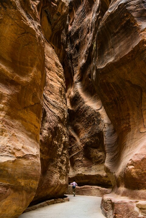 Hiker in Narrow Sandstone Canyon