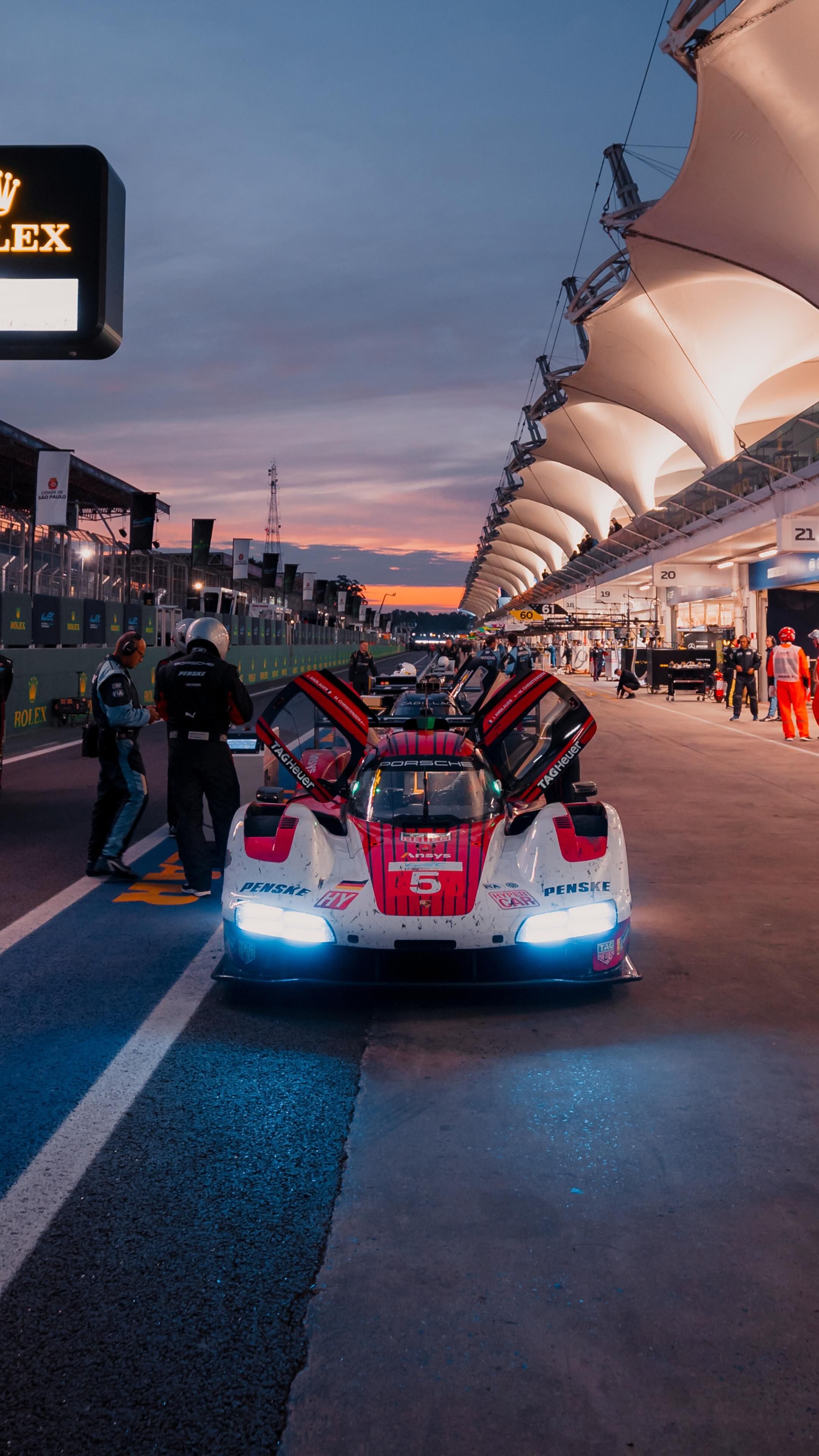 Porsche Race Car in Pit Lane at Dusk