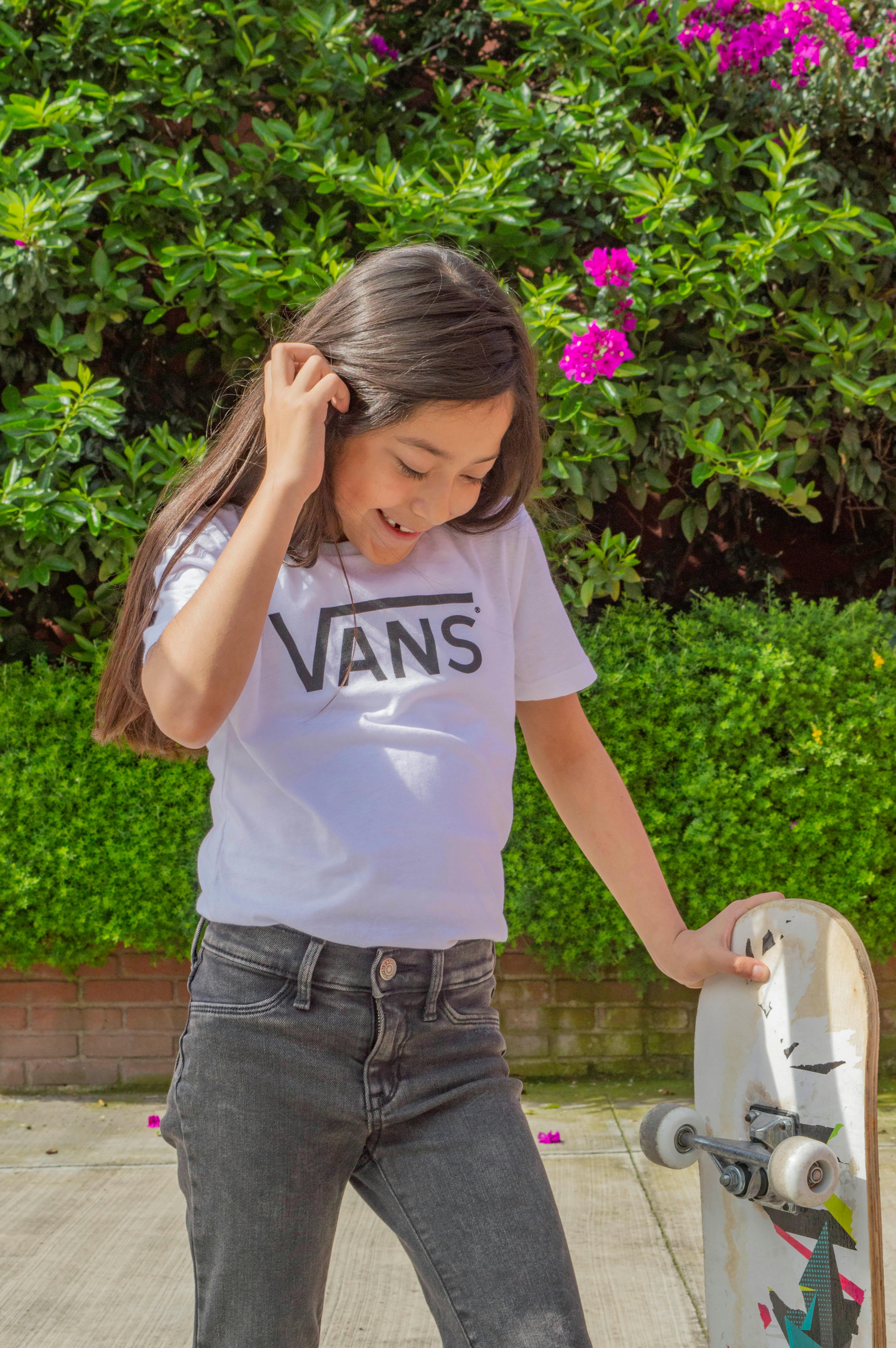 Girl Holding Skateboard Outdoors