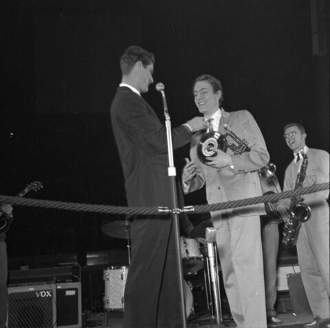 Musician Receiving Award On Stage