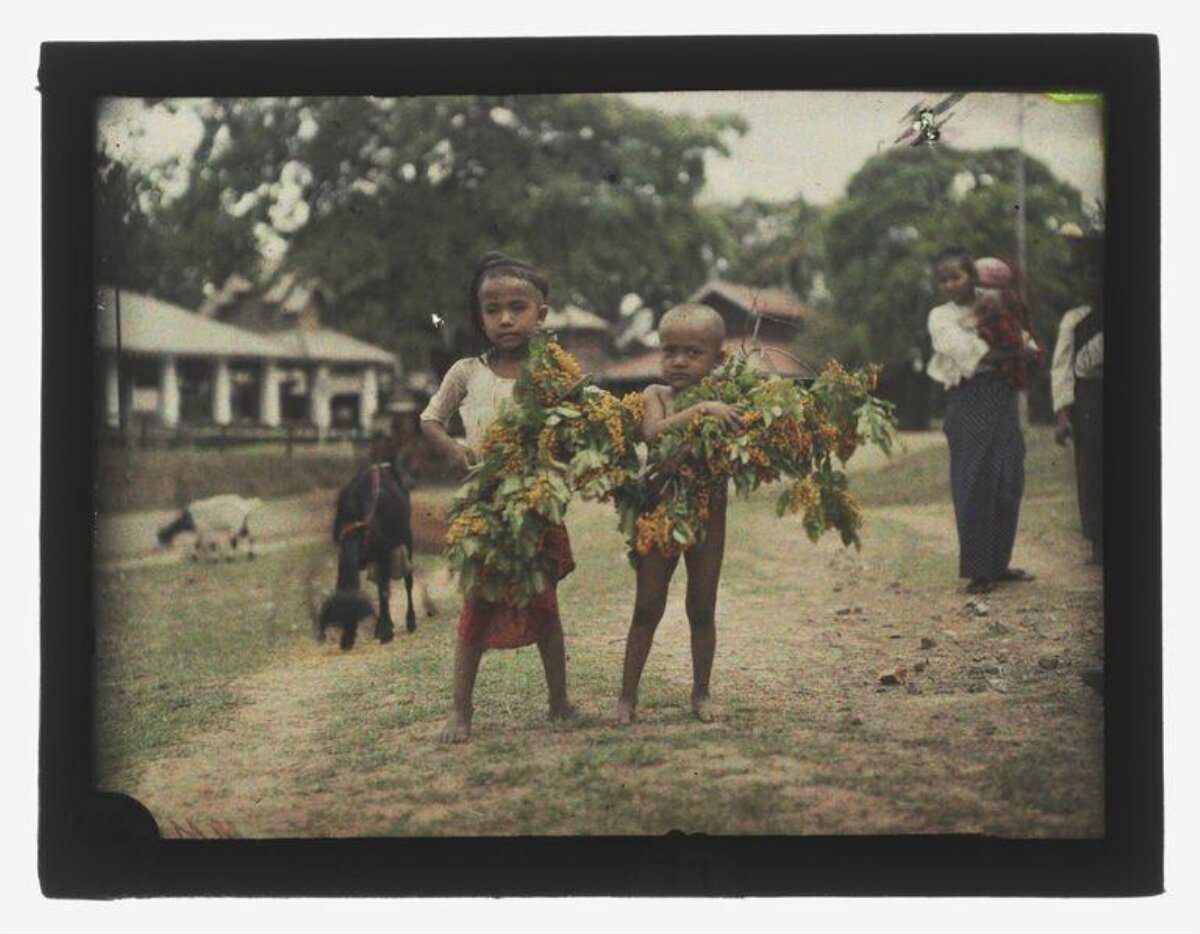 Two Children Holding Flower Branches
