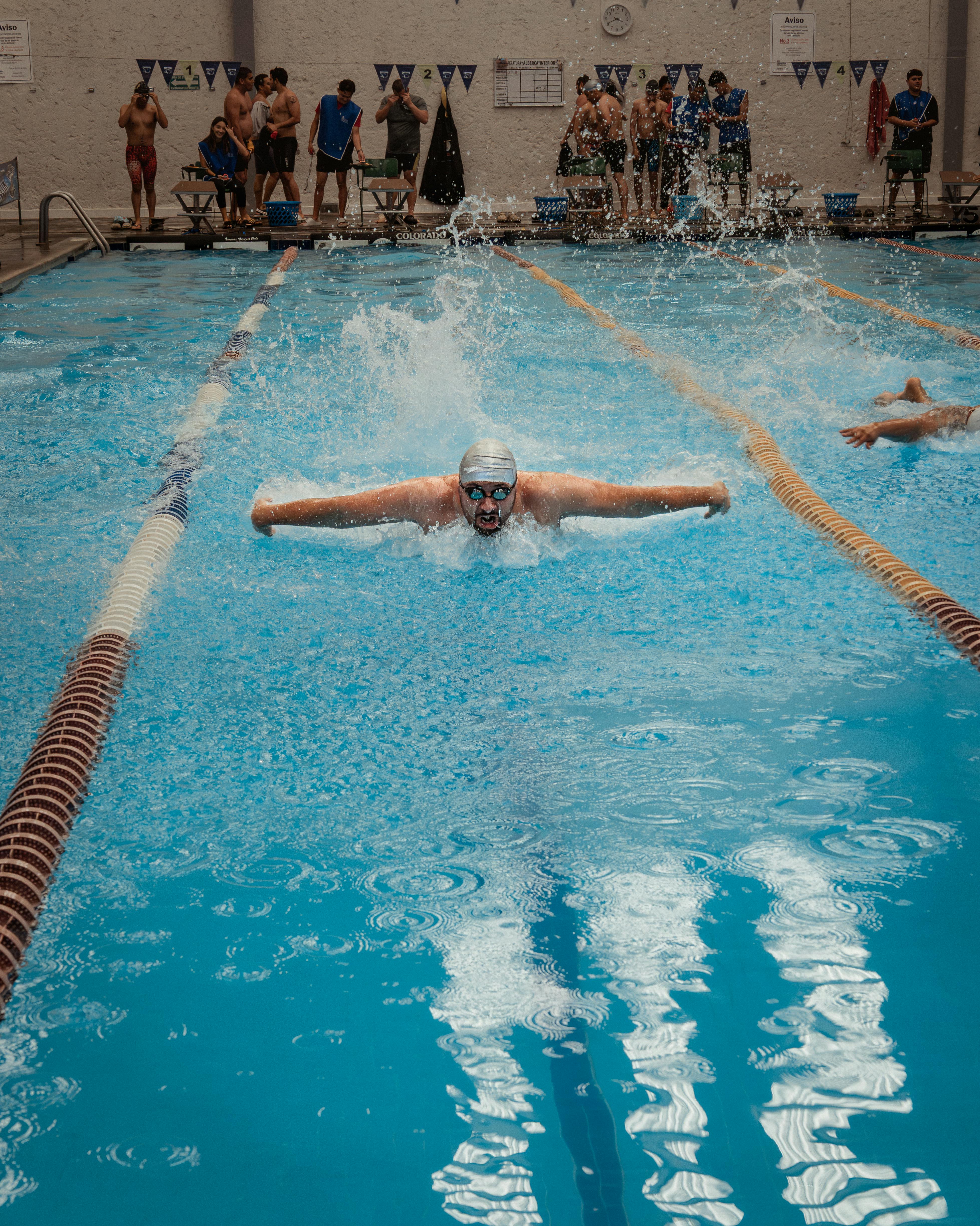 Swimmer Competing in Indoor Swim Meet