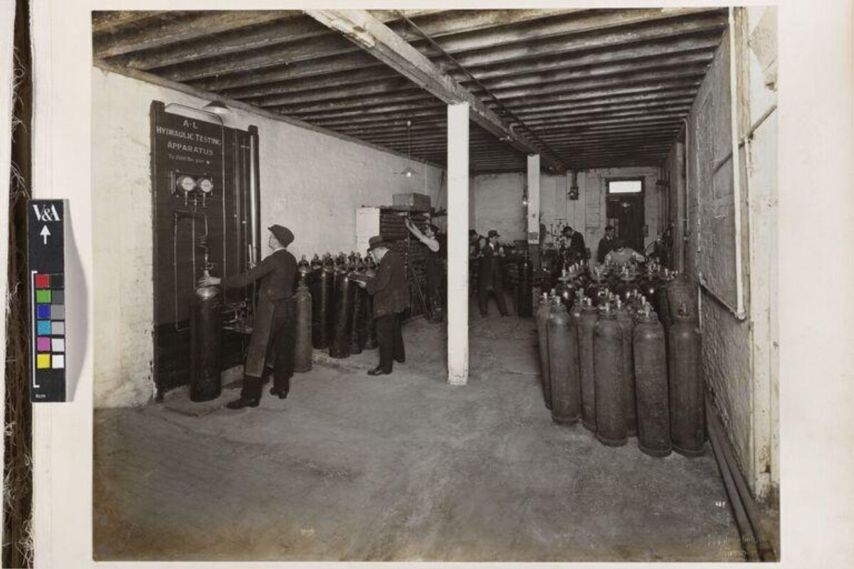 Workers Testing Gas Cylinders in Factory