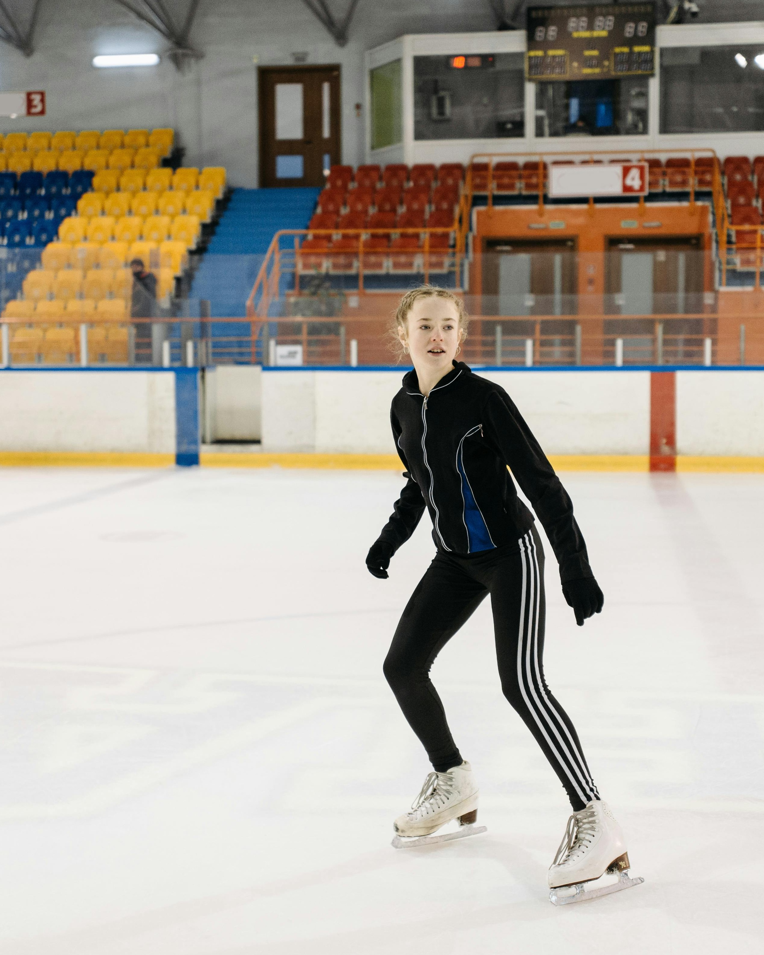 Figure Skater Training on Indoor Ice Rink
