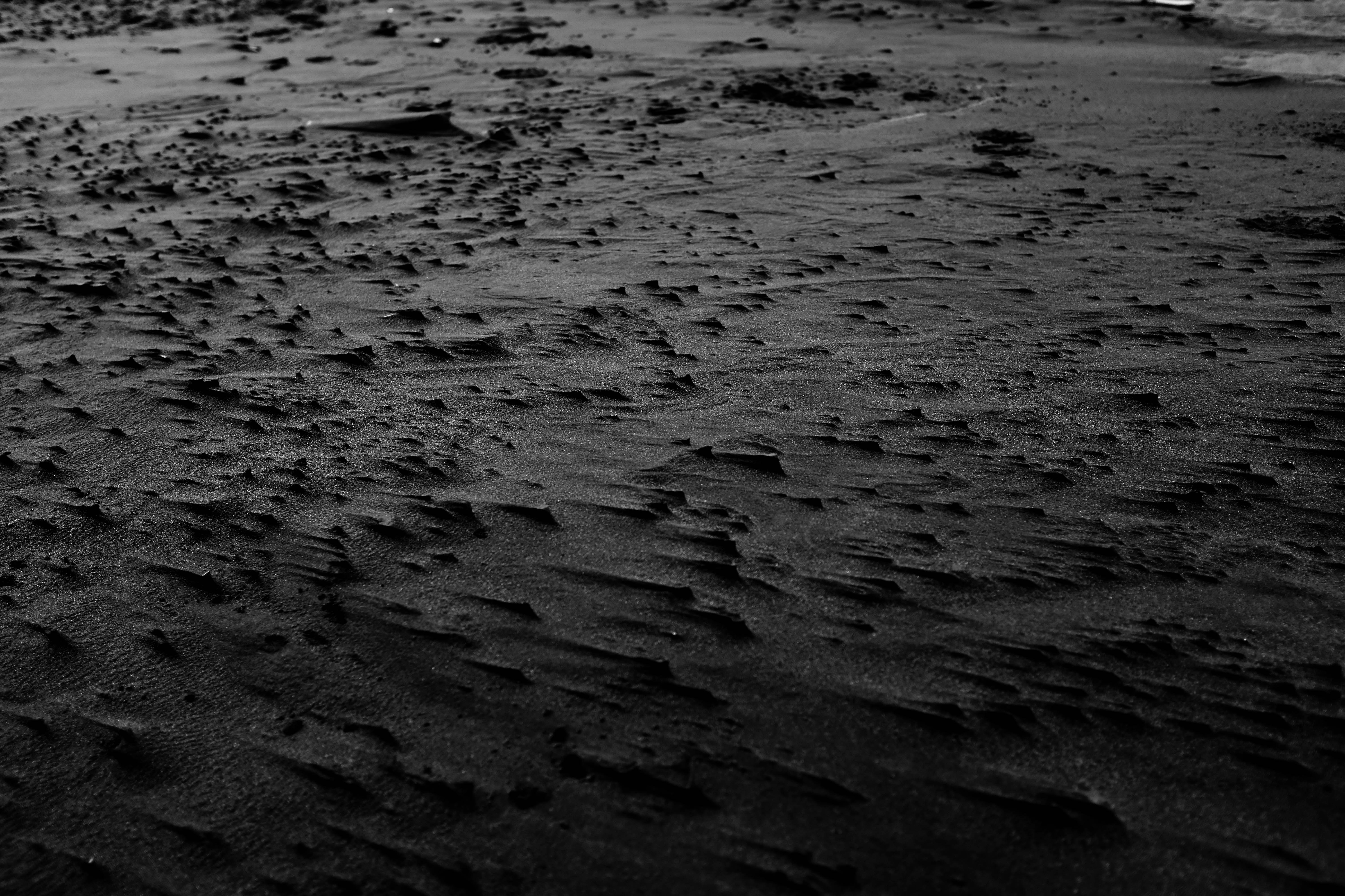 Textured Black Sand Surface