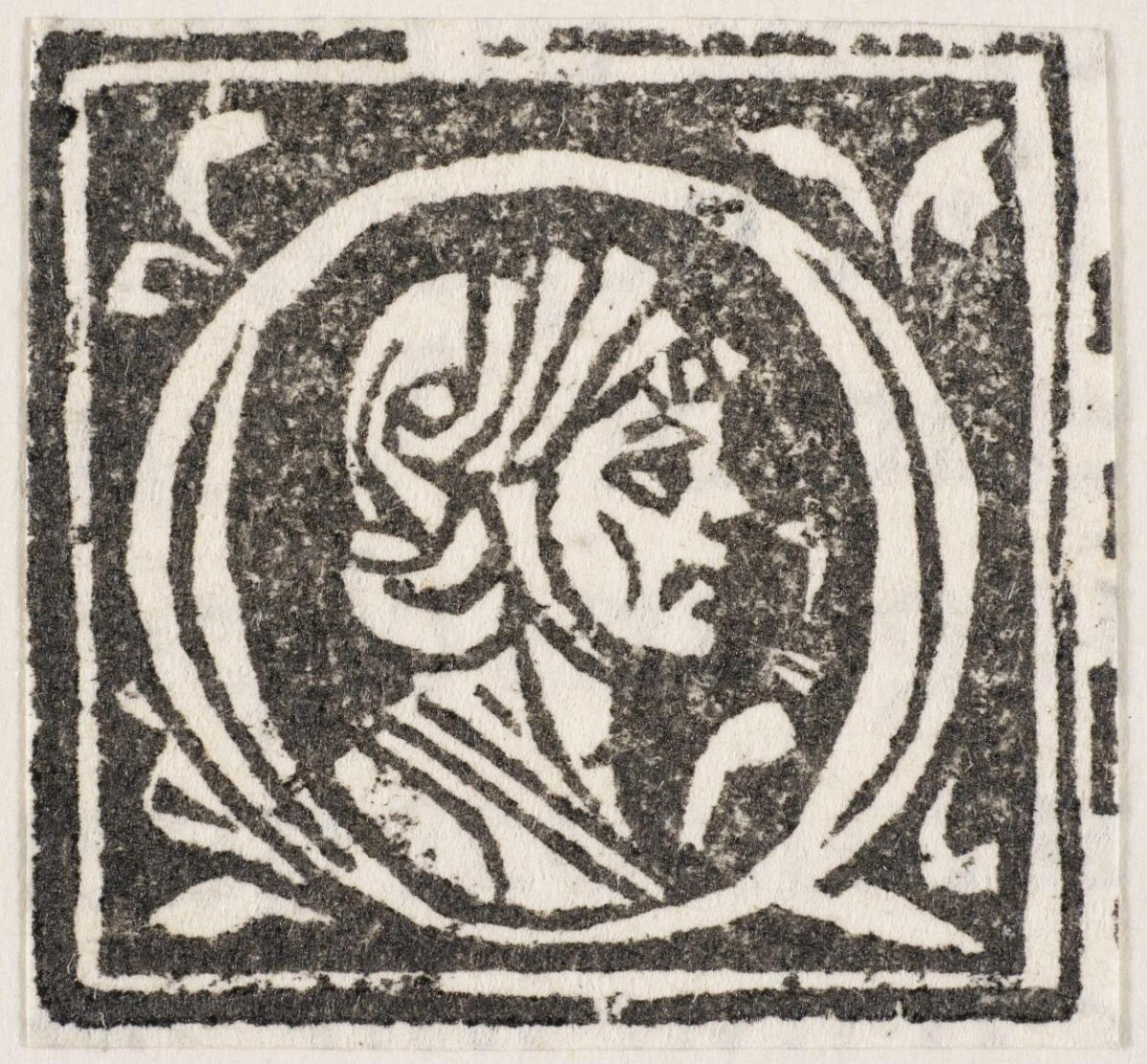 Woodcut Initial Q with Man Portrait
