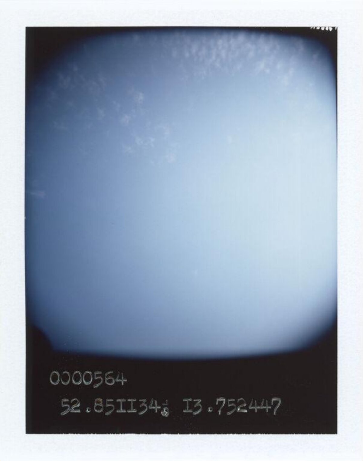 Polaroid Shot of Blue Sky with Coordinates