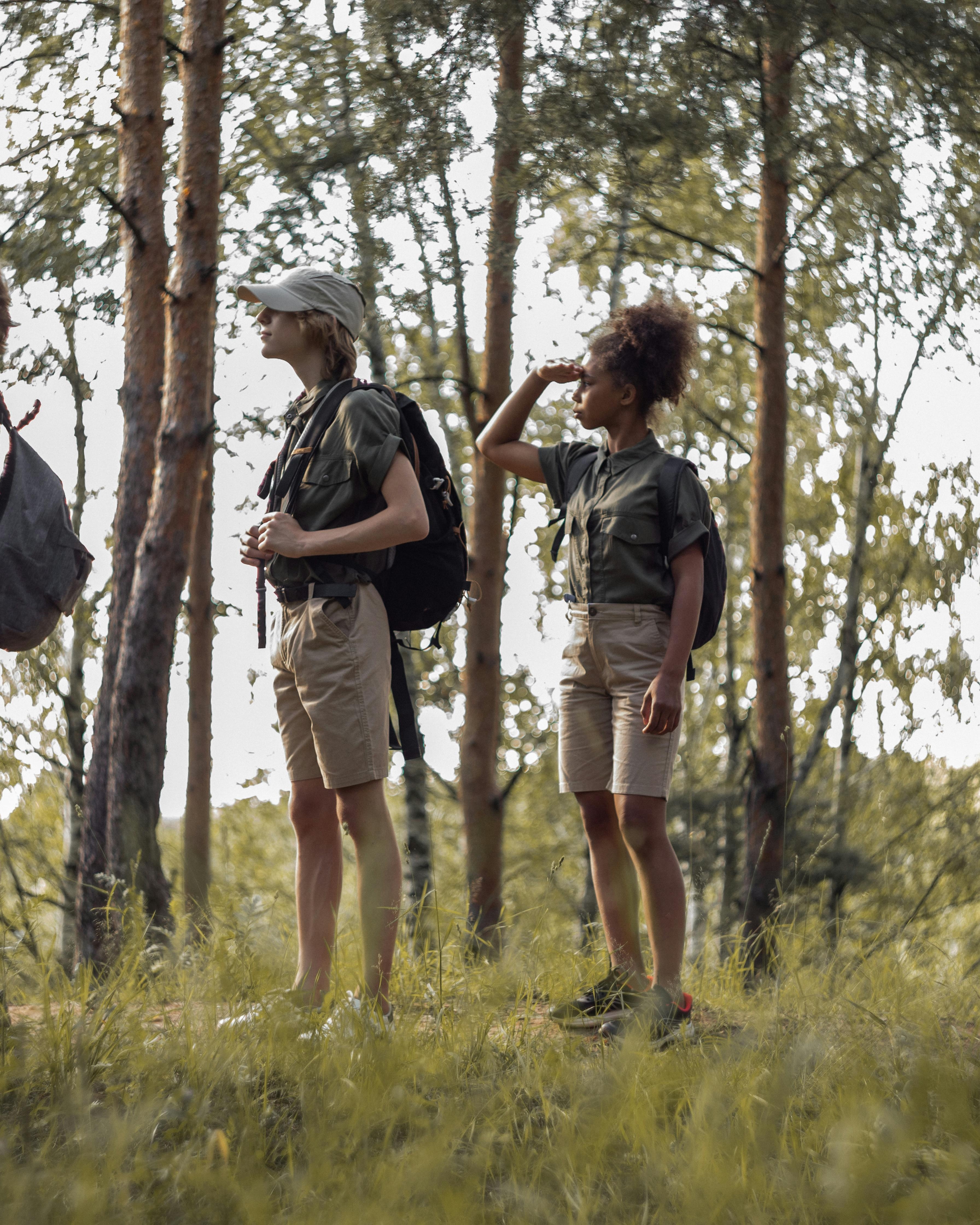 Two Hikers Scouting in a Forest
