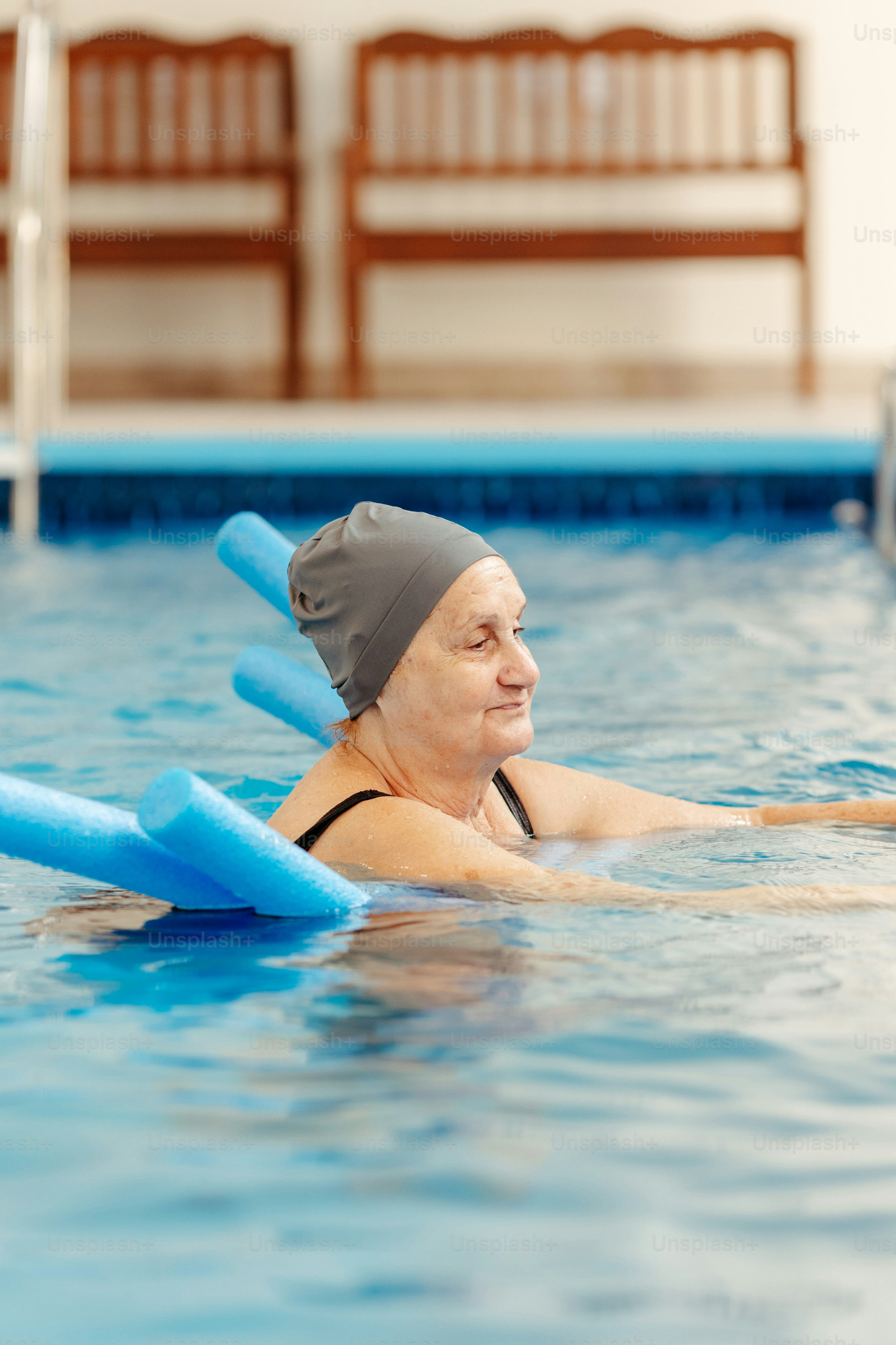 Senior Woman Doing Aqua Therapy in Pool
