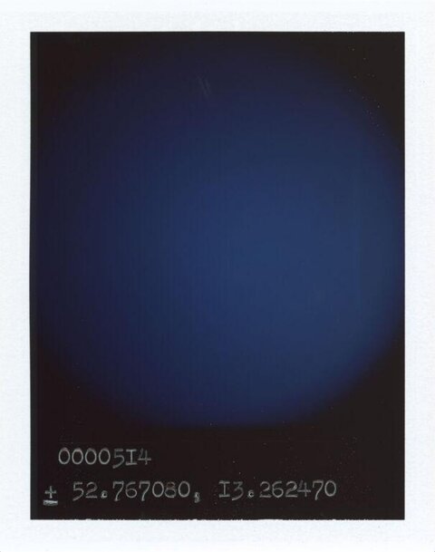 Dark Blue Polaroid with Handwritten Coordinates