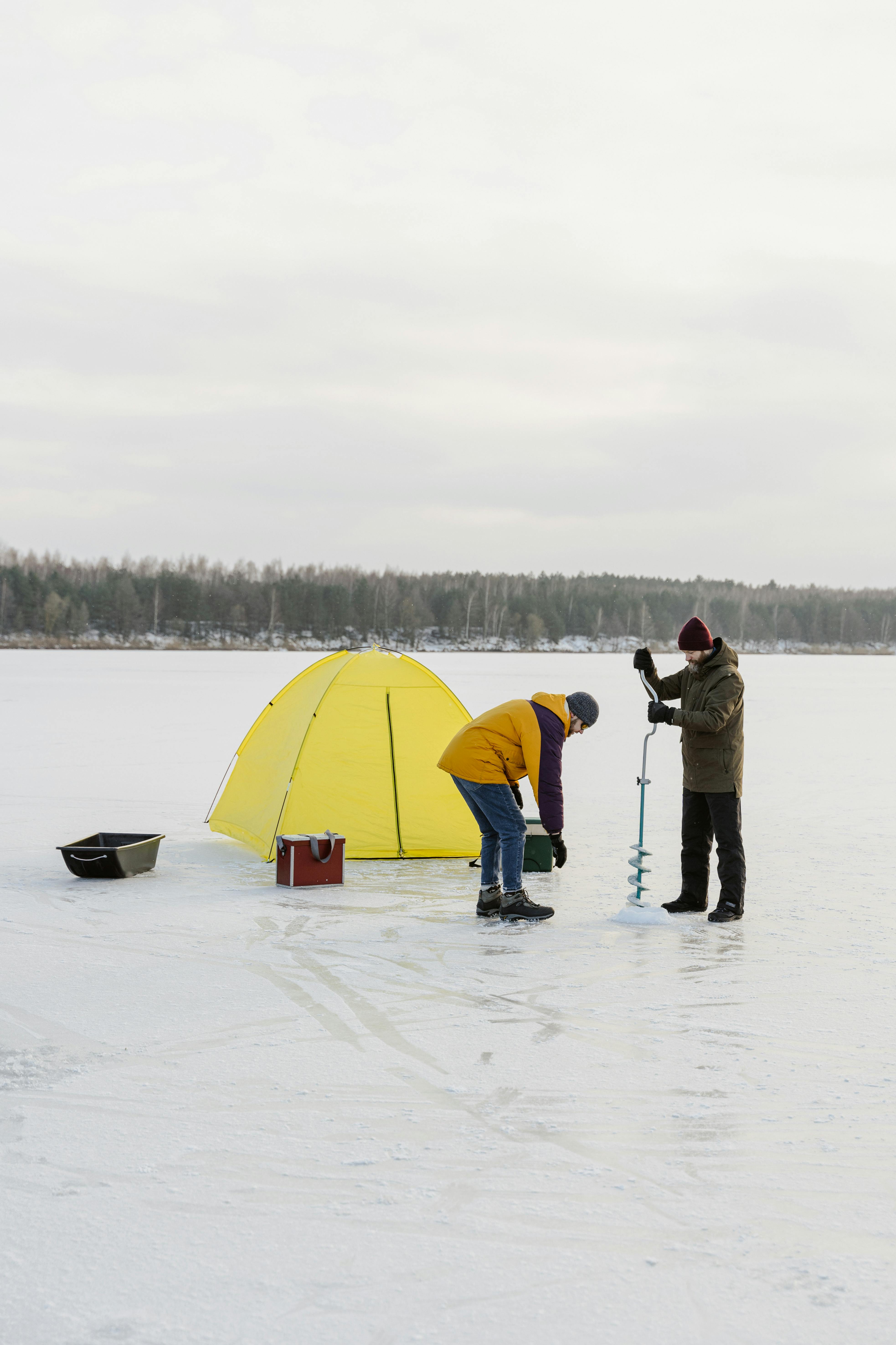 Two Men Preparing for Ice Fishing