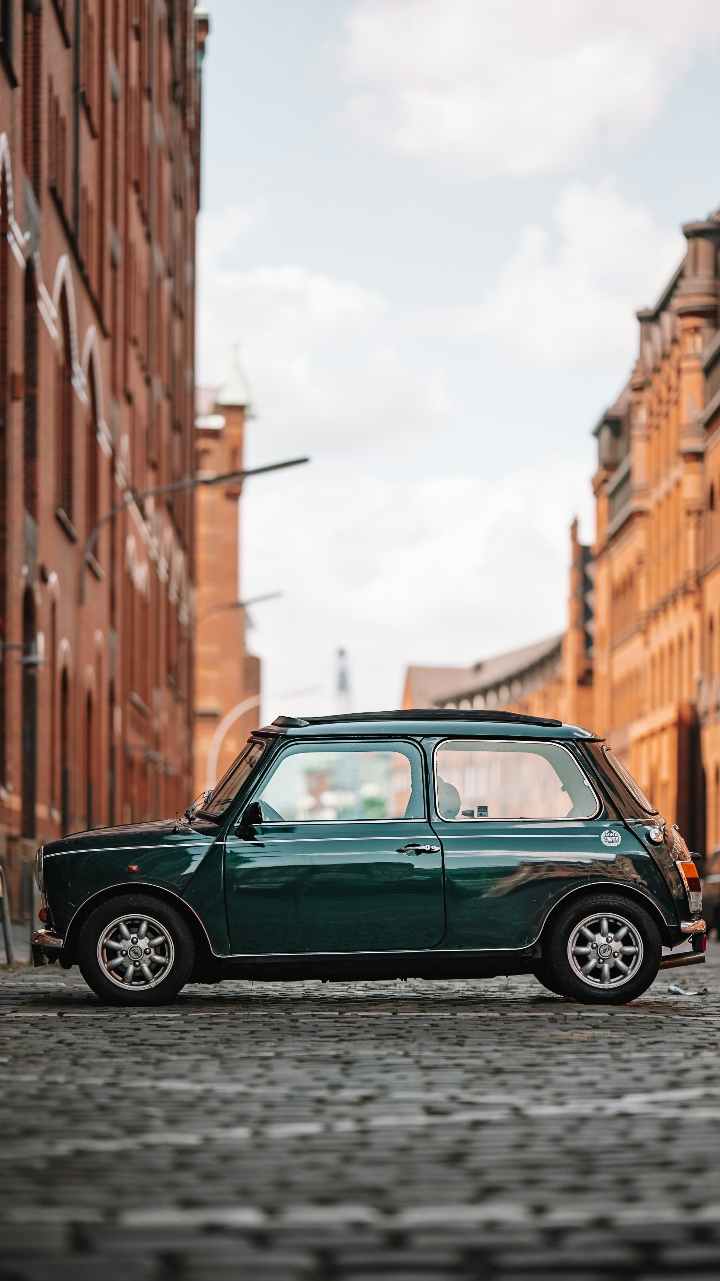 Vintage Green Mini Cooper on Cobblestone Street