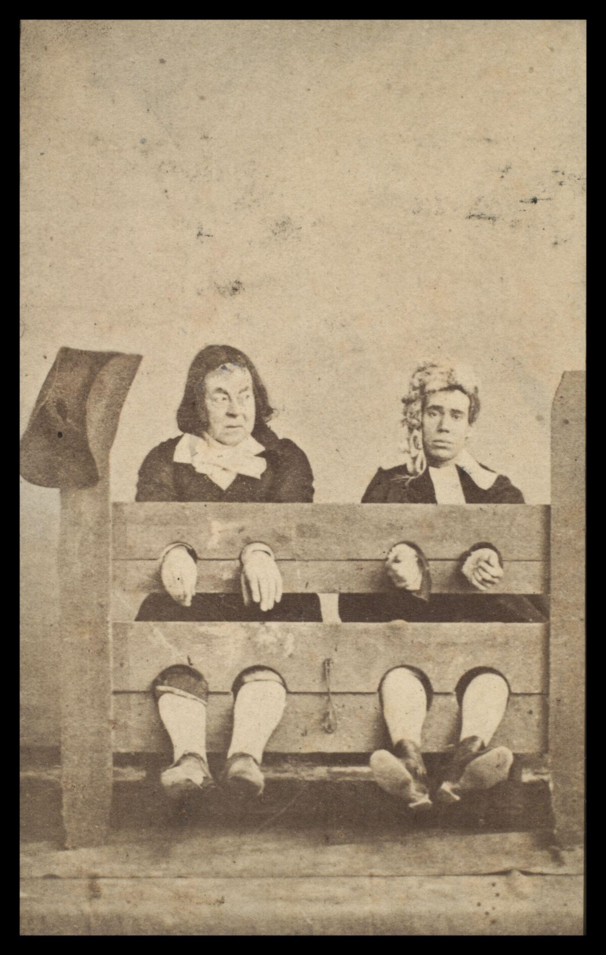 Two People Held in Wooden Pillory