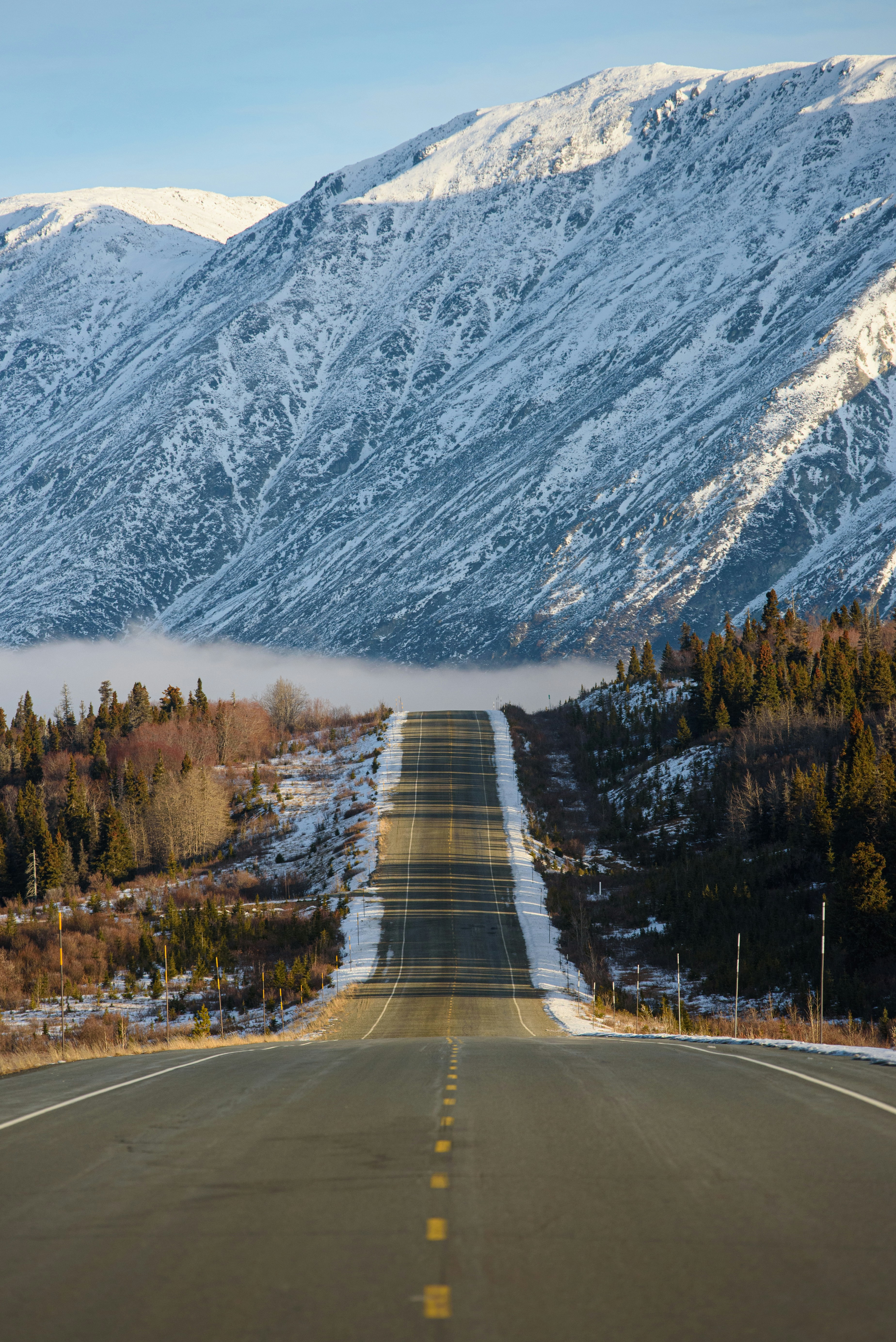 Highway Leading to Snow-covered Mountains