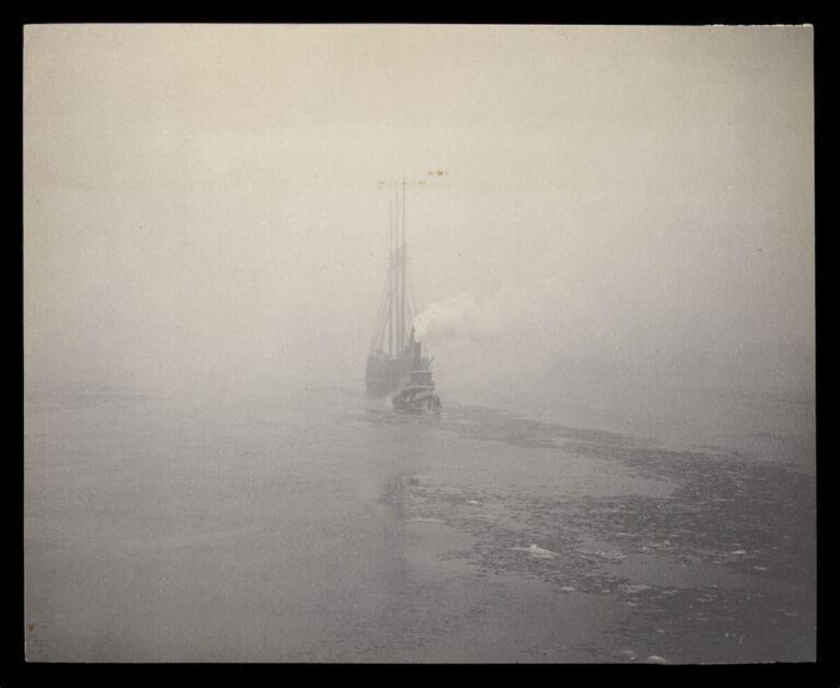 Ship in Foggy Frozen Sea