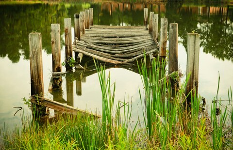 Old Decaying Wooden Dock on Lake