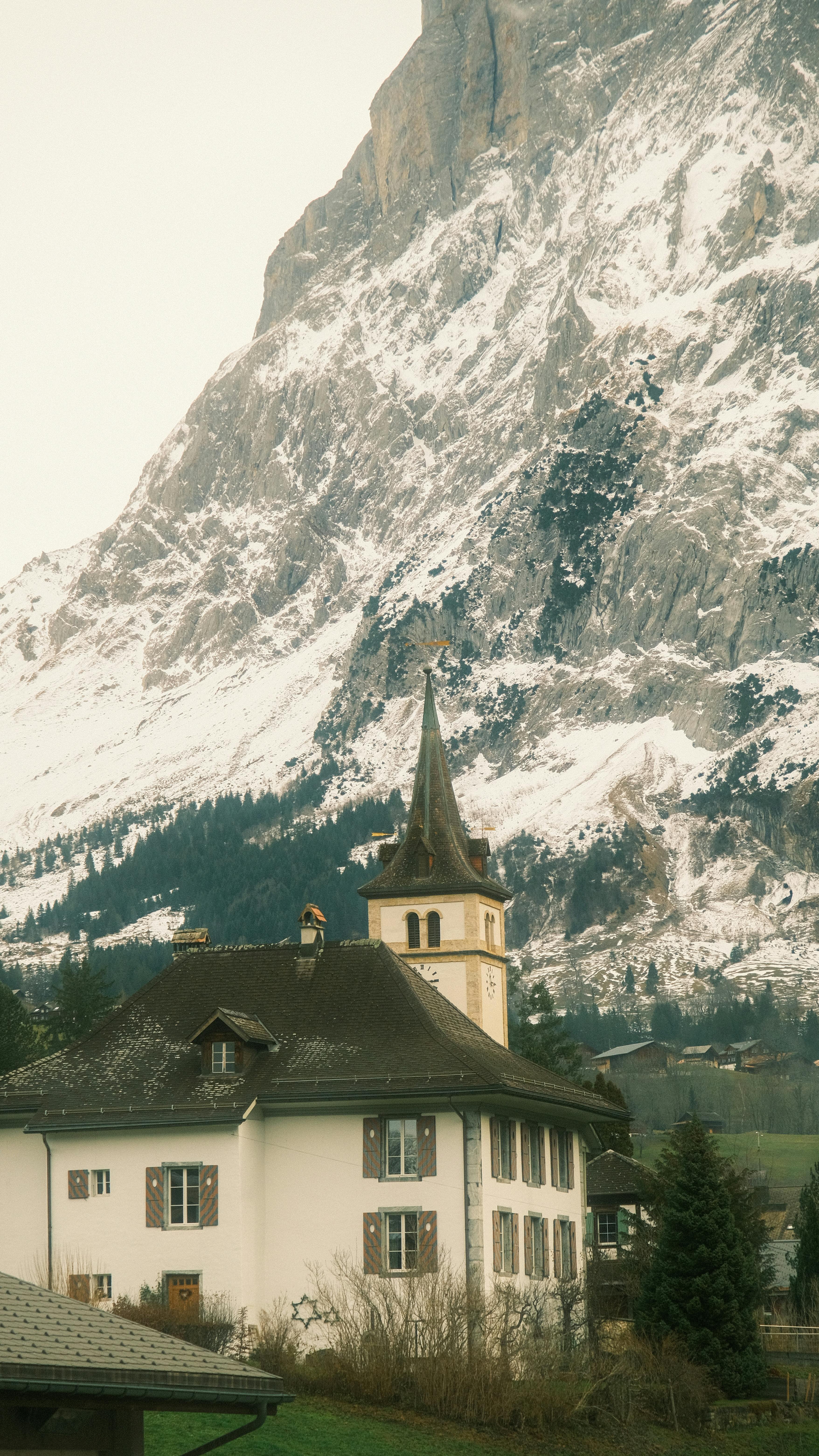 Alpine Village Church Below Snowy Mountain
