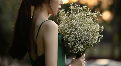 Woman Holding Baby's Breath Bouquet