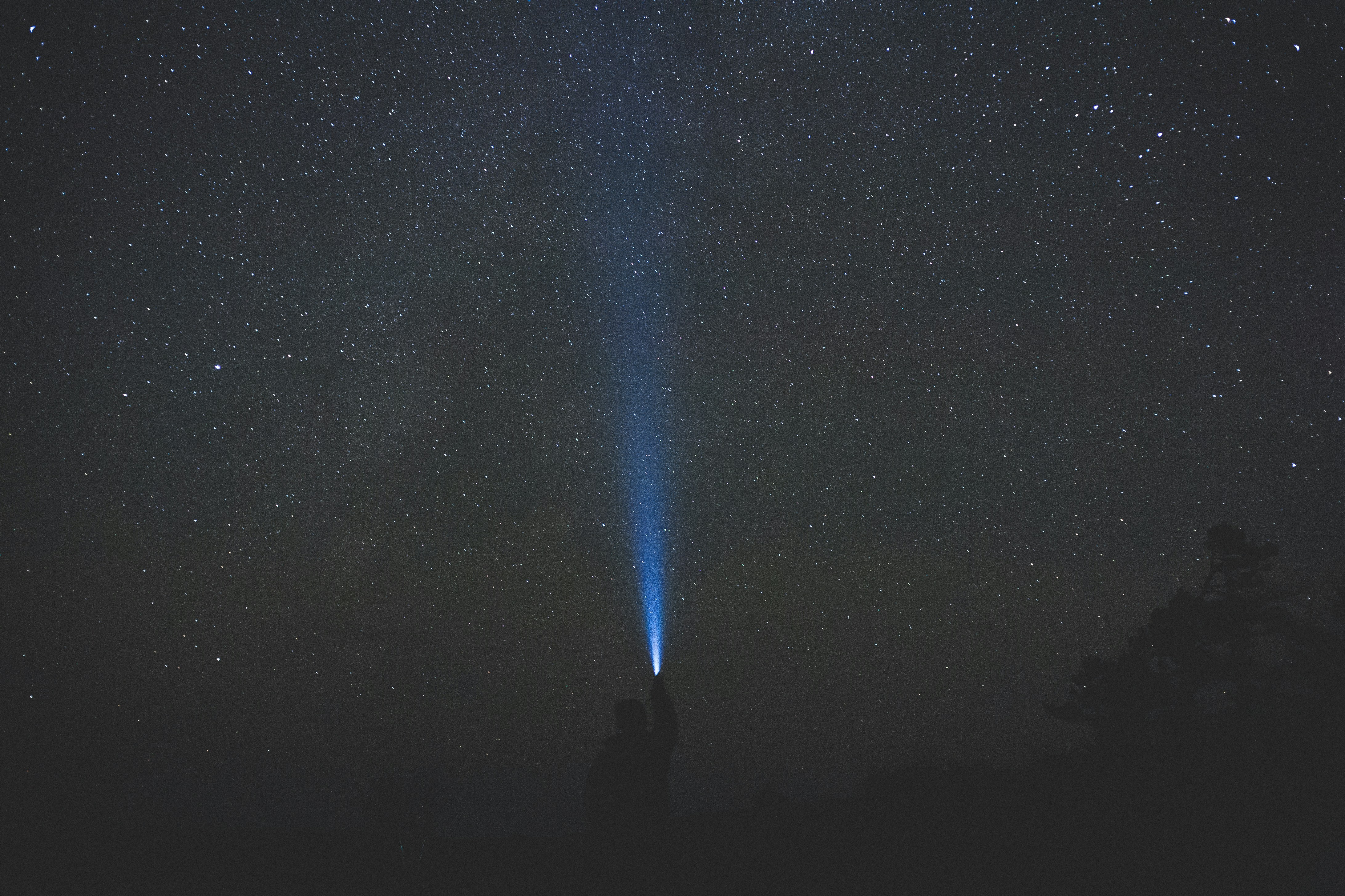 Shining Flashlight At Starry Sky