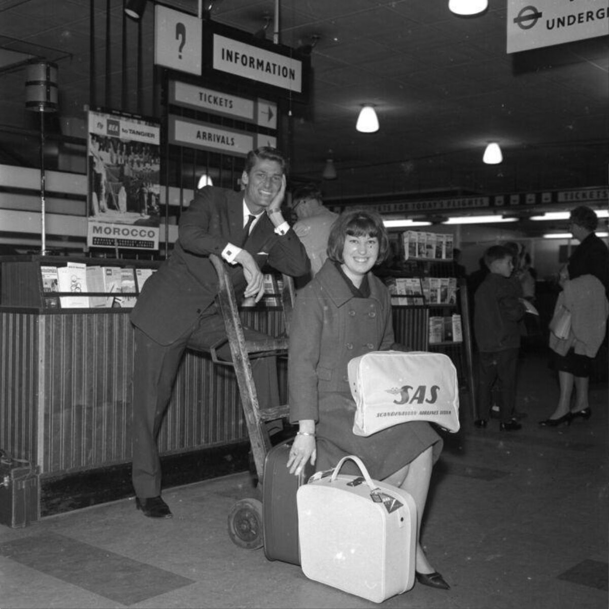 Couple at Airport Information Counter