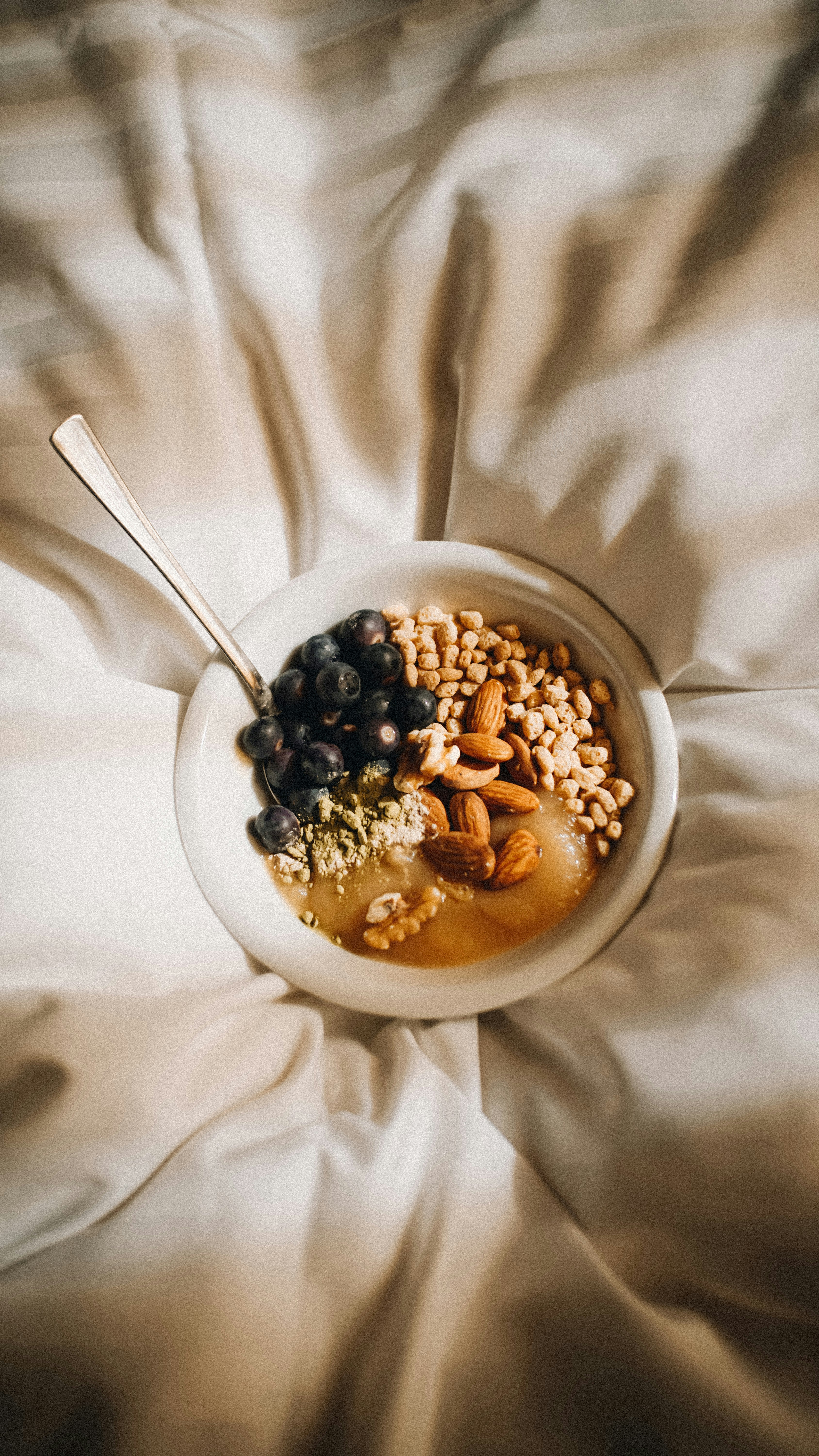Healthy Breakfast Bowl on Bed Sheets