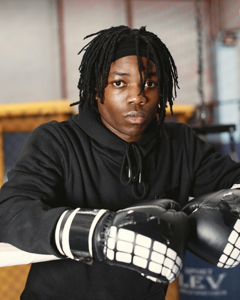 Boxer with Boxing Gloves in Gym