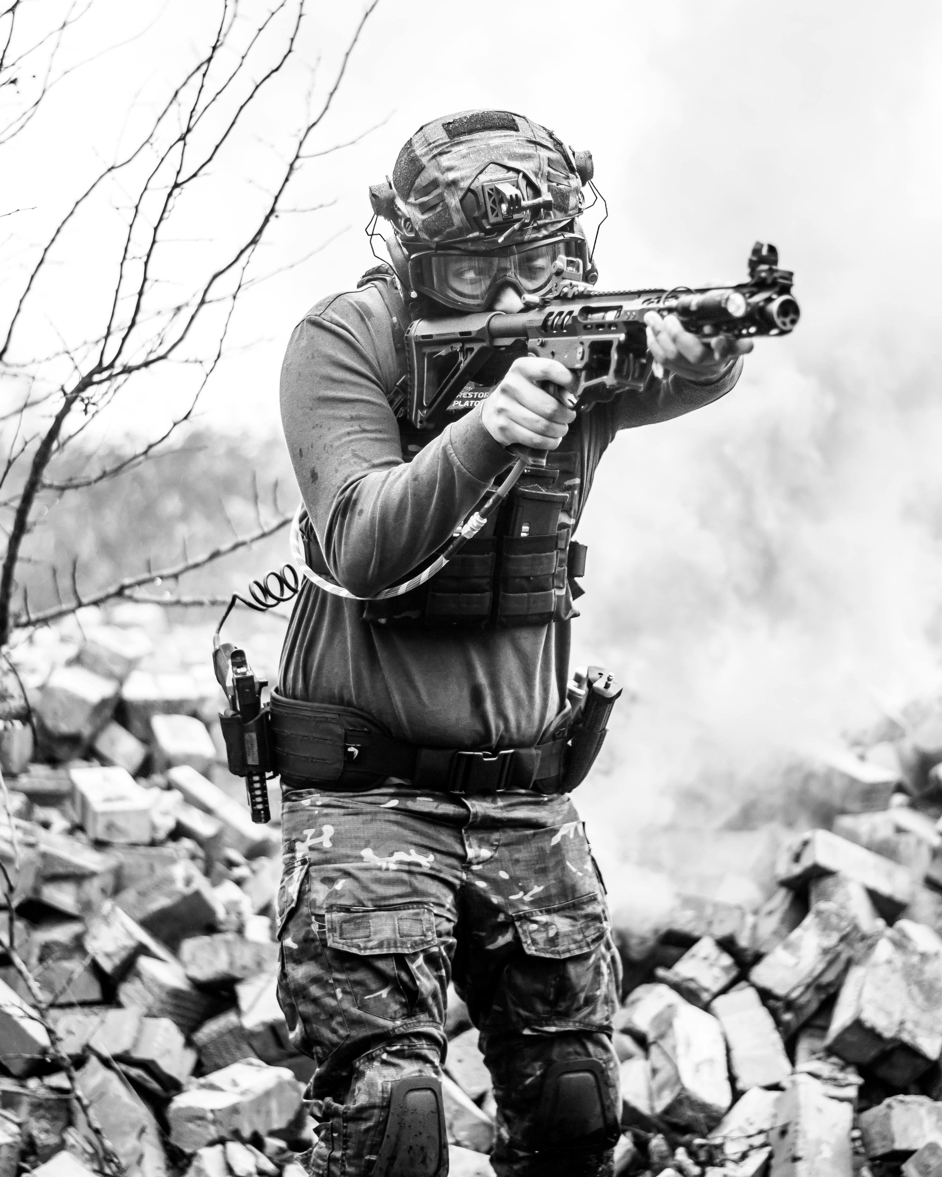 Tactical Airsoft Player Aiming Rifle