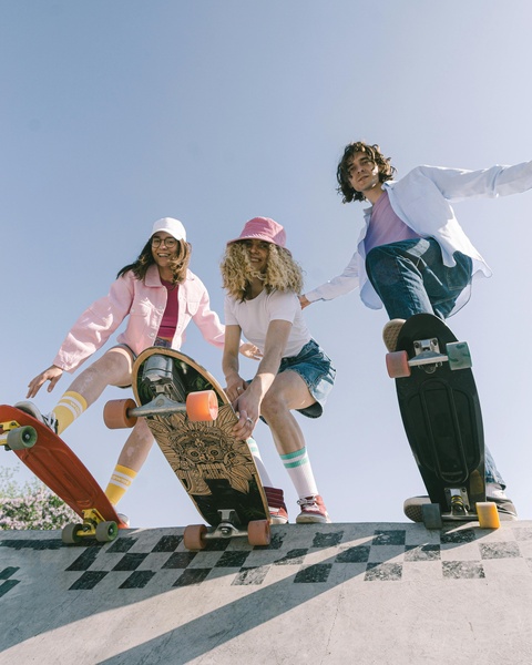 Three Skaters at Outdoor Skatepark