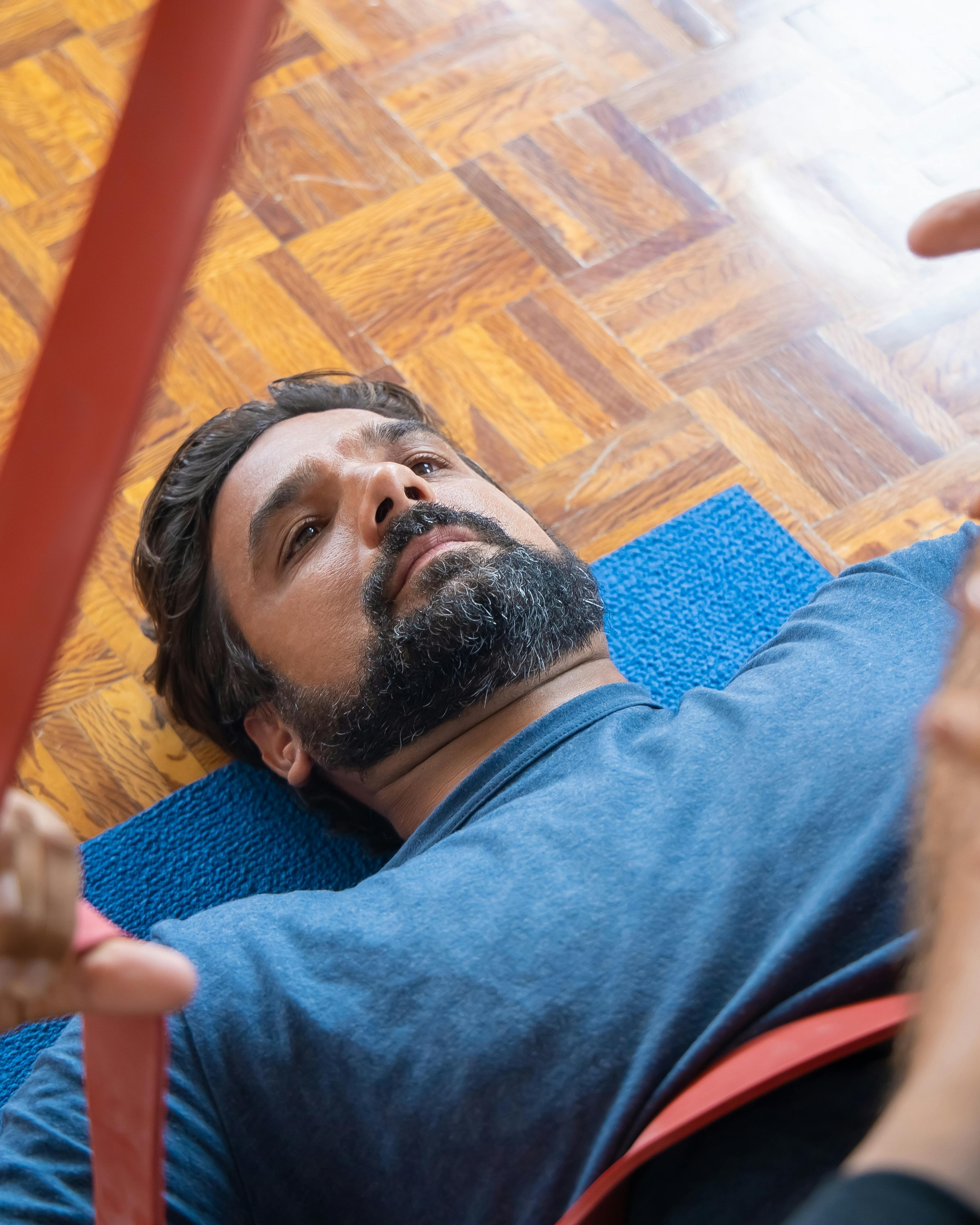 Man Working Out With Resistance Band