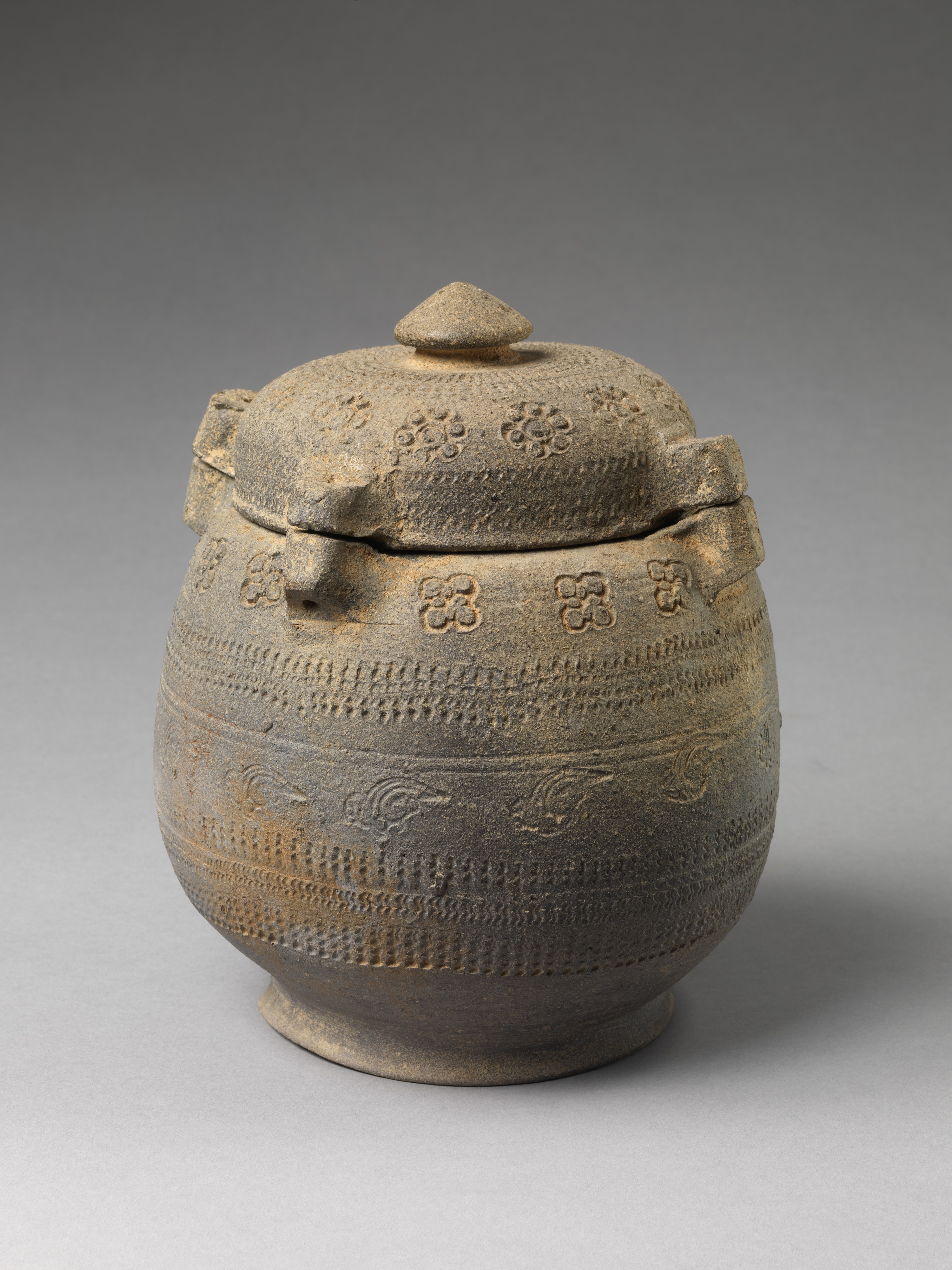 Ancient Patterned Covered Pottery Jar
