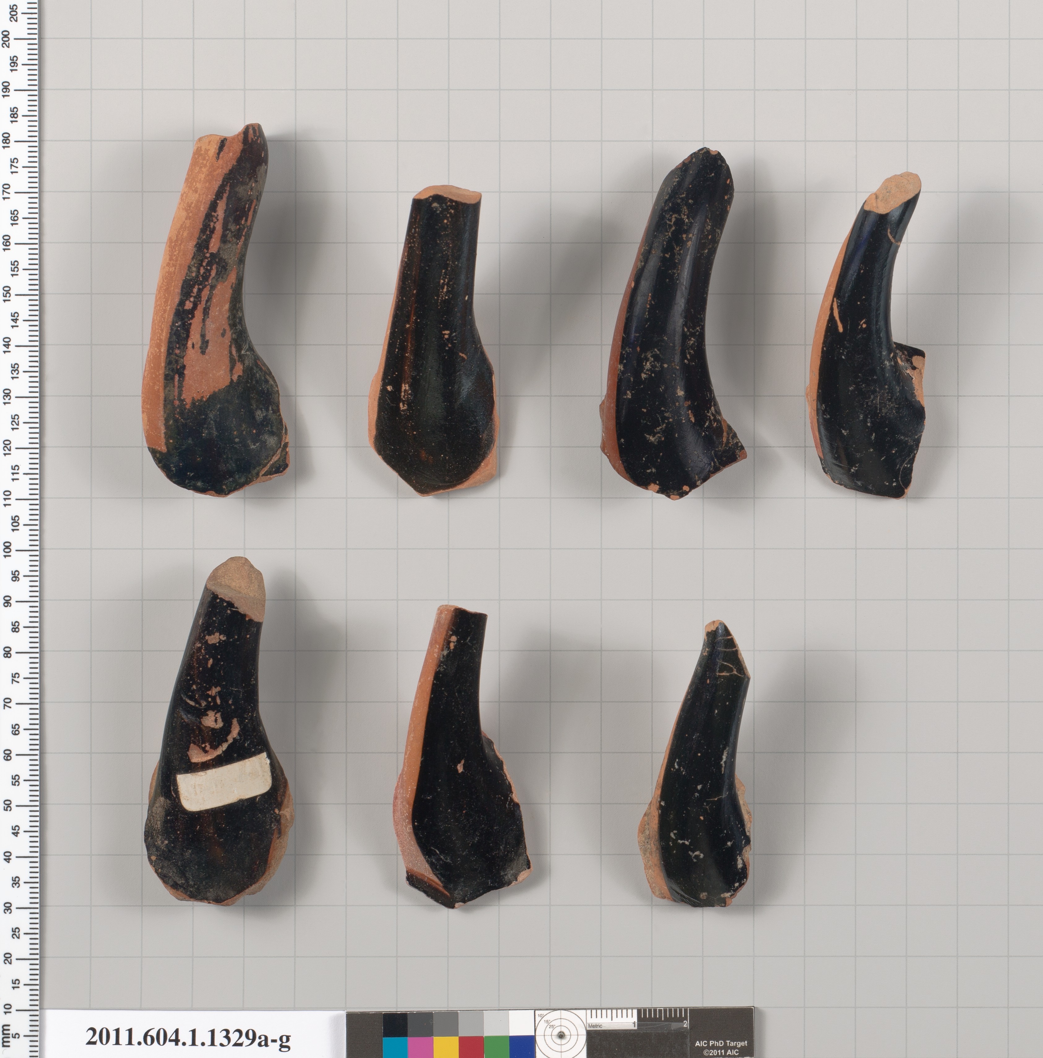 Seven Ancient Pottery Handle Fragments