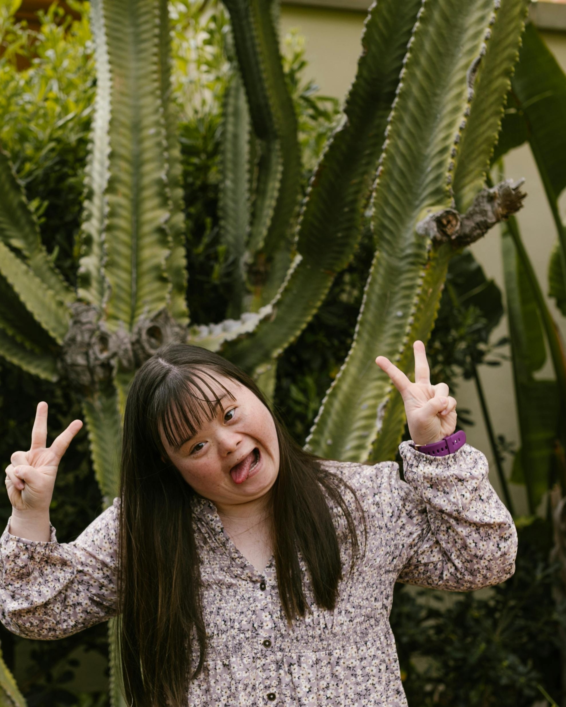 Woman With Down Syndrome Making Peace Signs