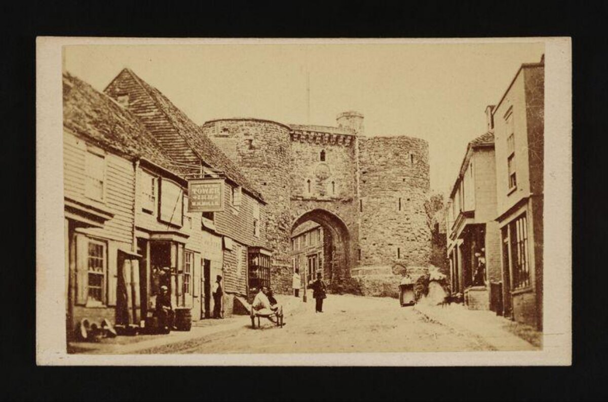 Vintage Town Street With Ancient Stone Gate