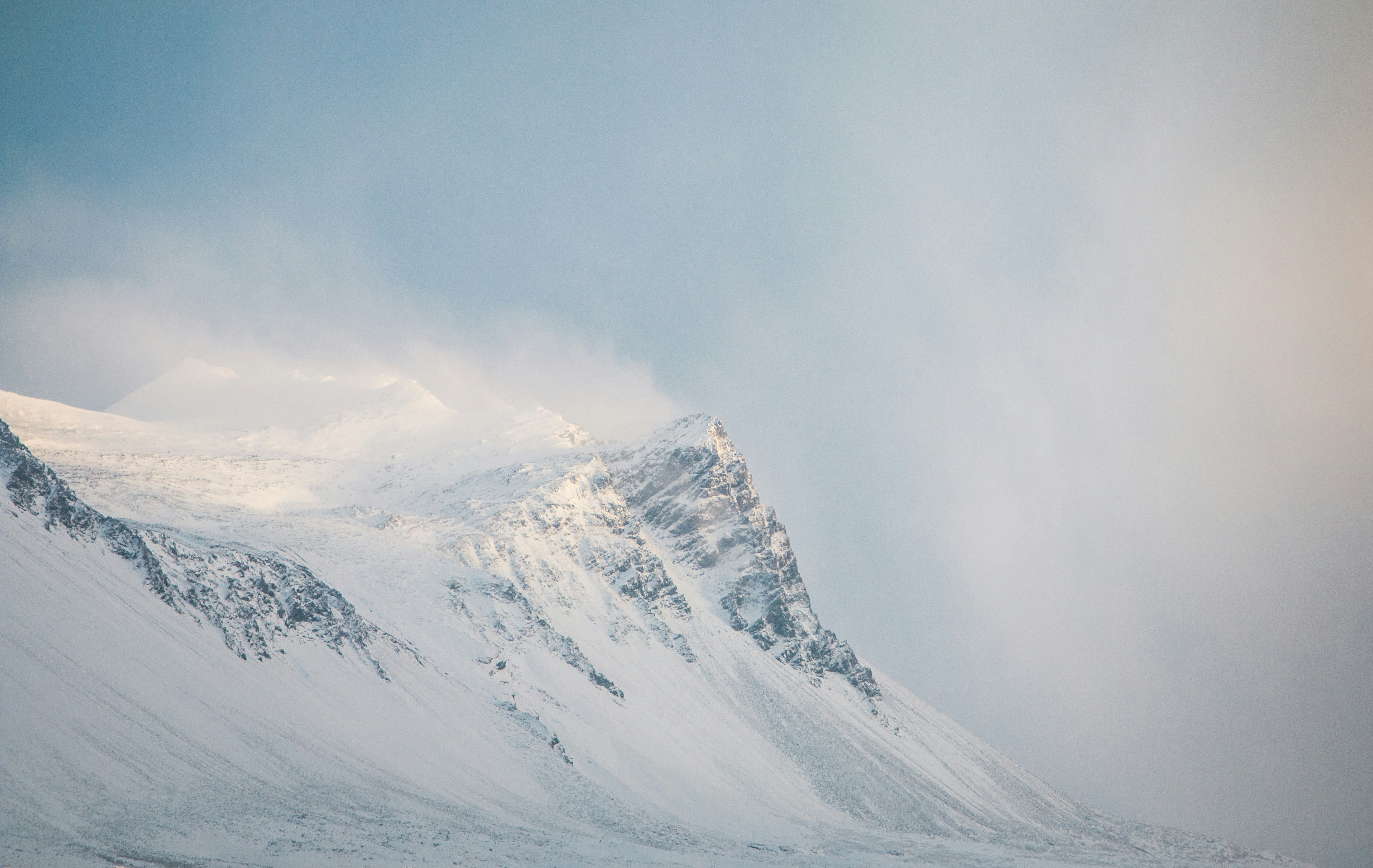 Snow-Covered Misty Mountain Peak