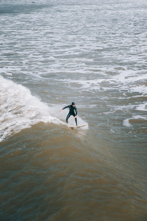 Surfer Riding Sea Wave