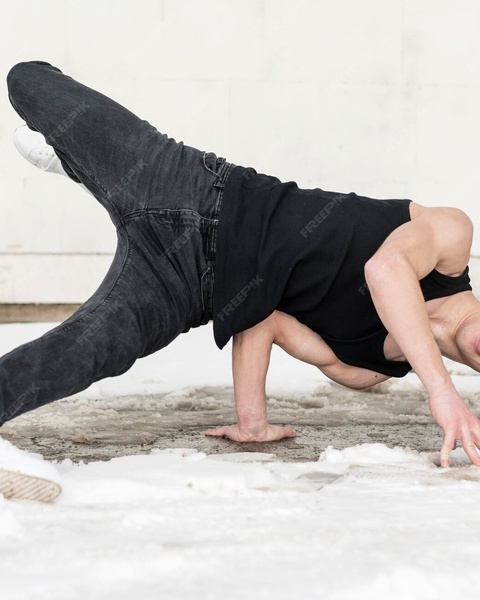 Breakdancer Practicing on Snowy Ground