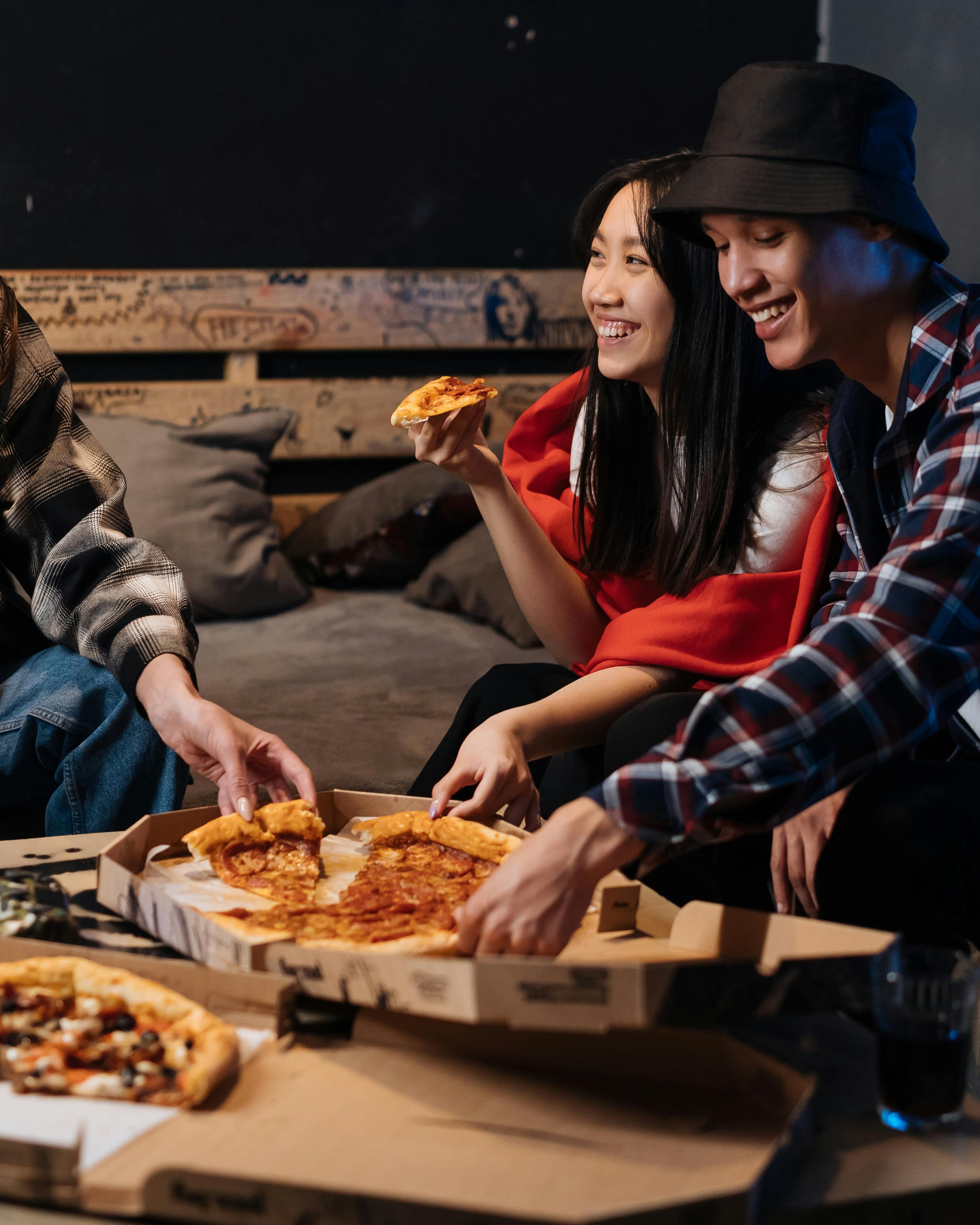 Friends Enjoying Pizza Together
