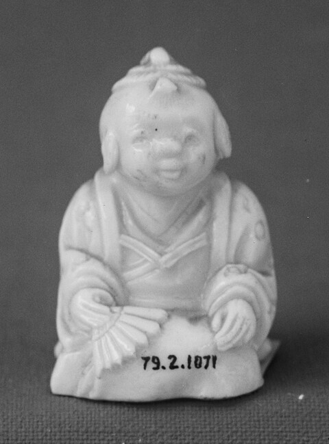 White Porcelain Seated Figurine
